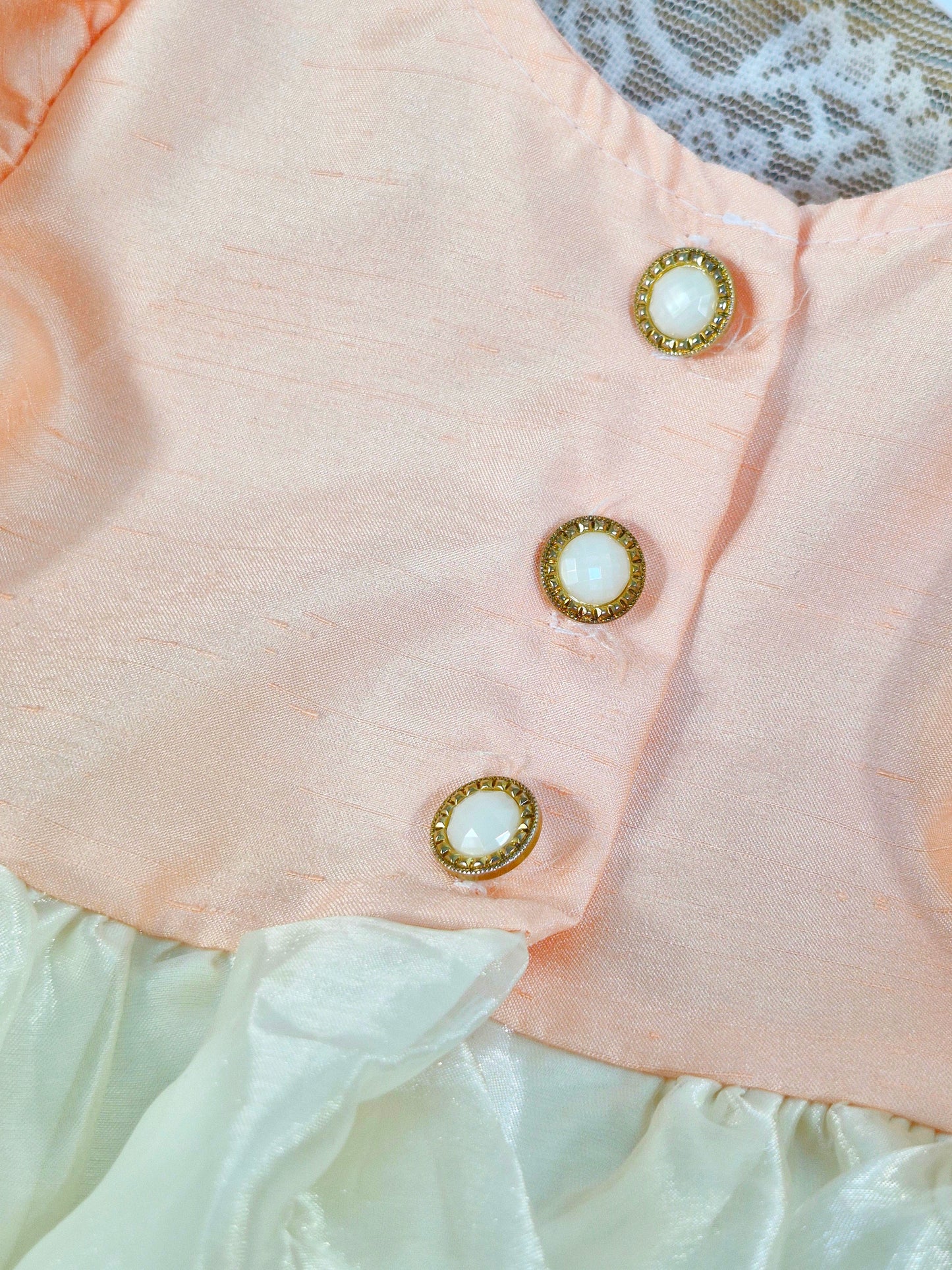 12 months. Peach and ivory taffeta dress with lovely buttons on back