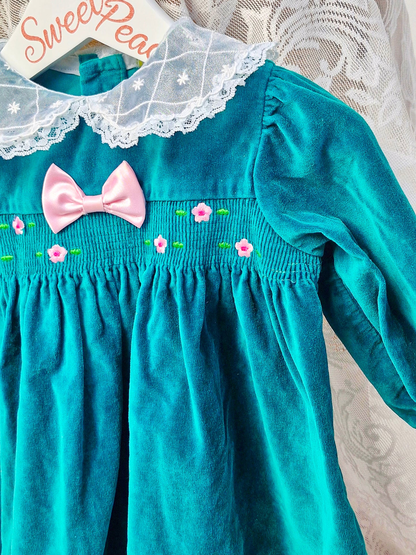 12 months. Emerald green velour dress with lace collar and pink details