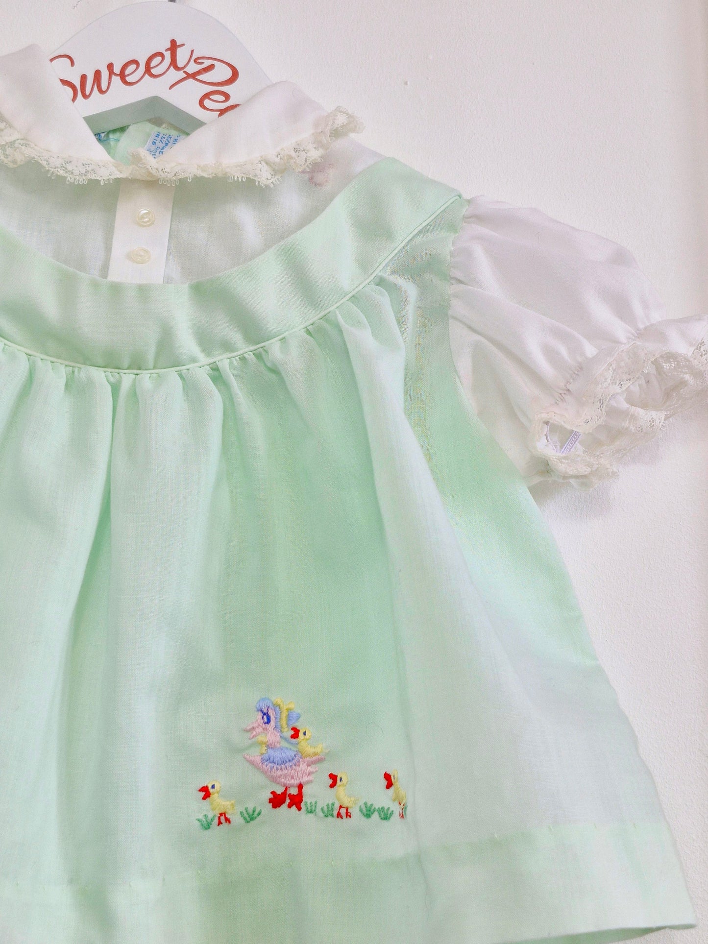 0-6 months. Mint and white vintage baby dress with embroidered ducks from Cherubs