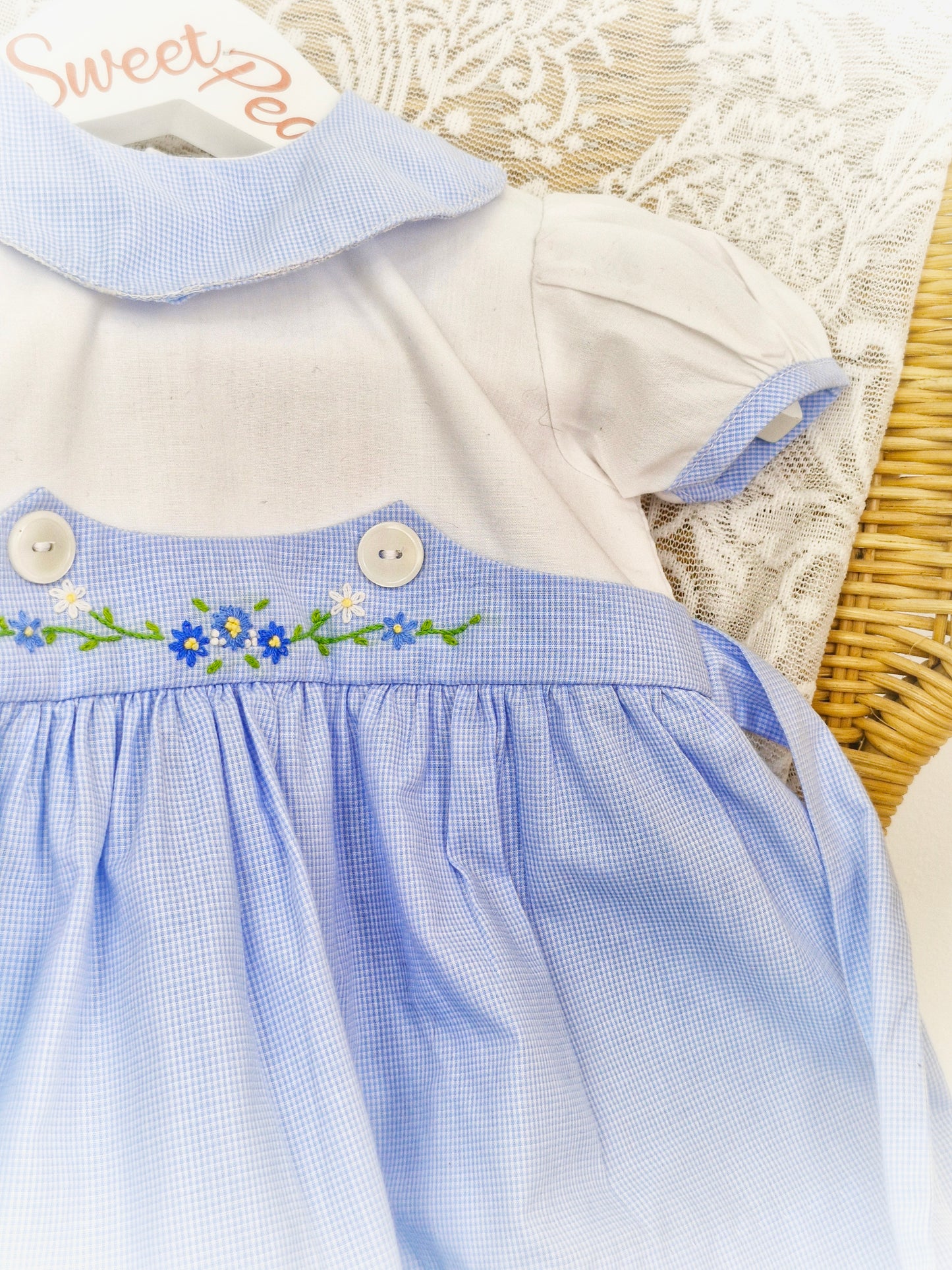 9-12 months. Blue and white dress with collar and embroidered flowers