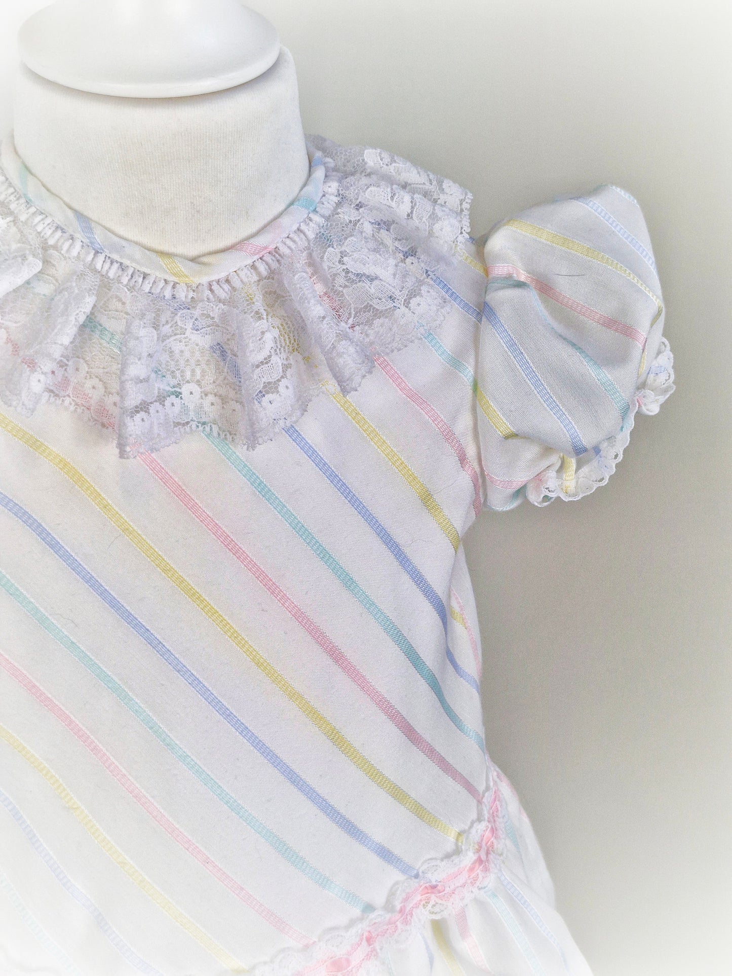 2-3 years. White dress with pastel stripes and lace collar
