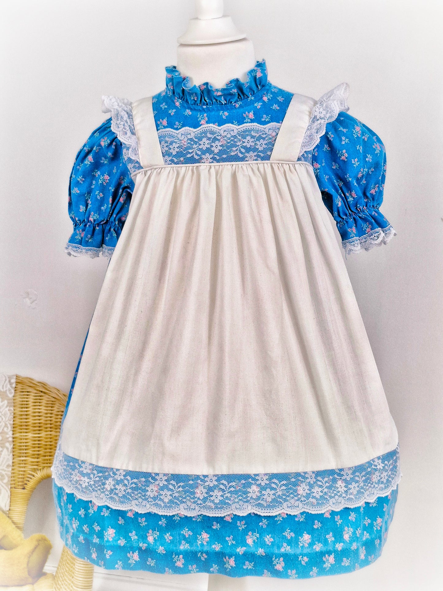 3-4 years. Blue floral Kawalla dress with attached white lace pinny