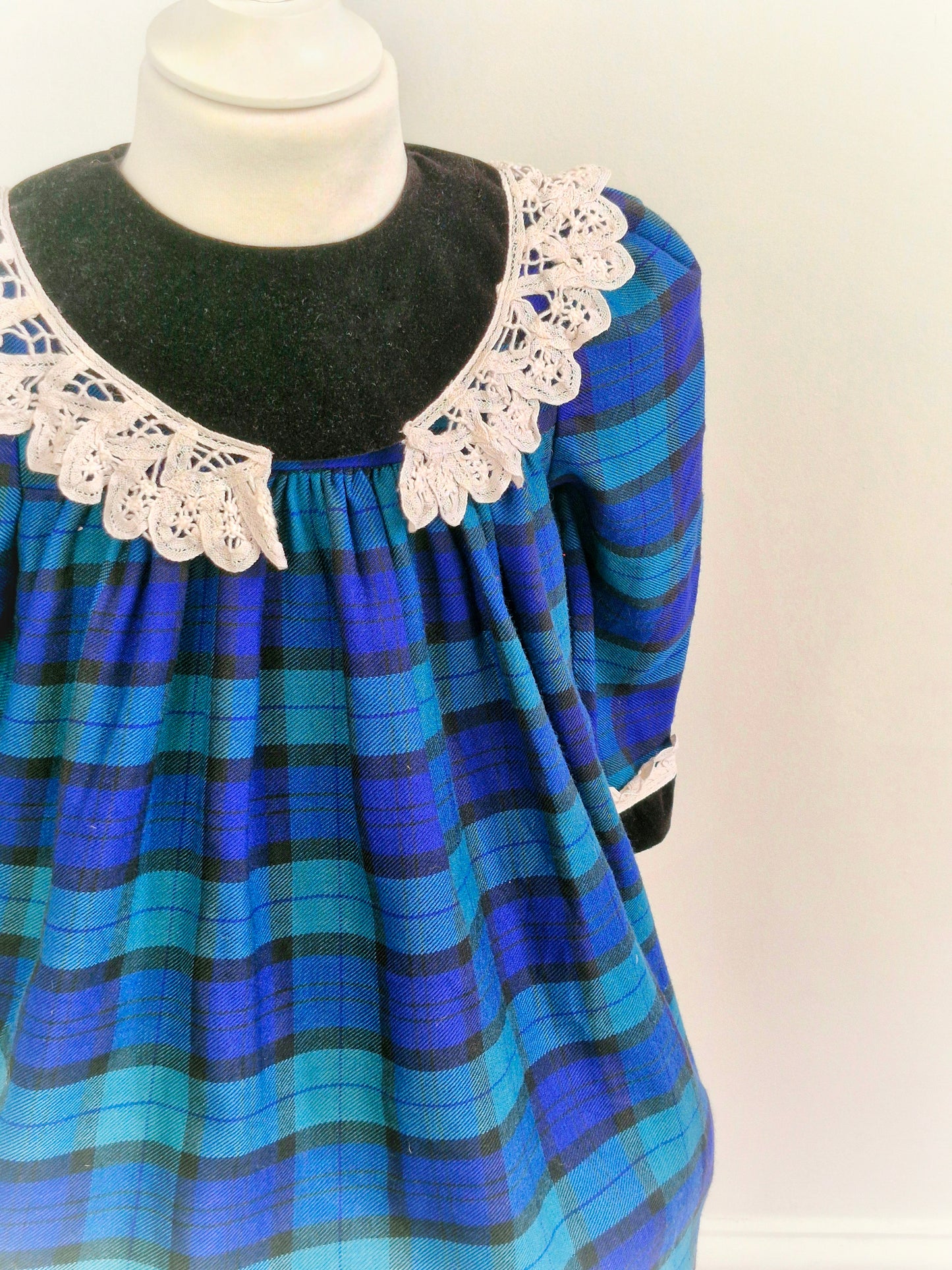 3 years. Blue, green and black tartan Emily Rose dress with crocheted details from 1961