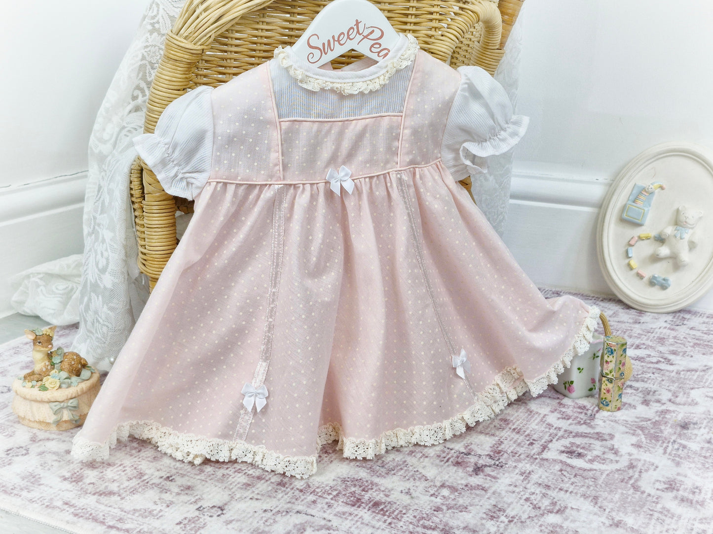 9-12 months. Pink and white polka dot dress with bows, 1960