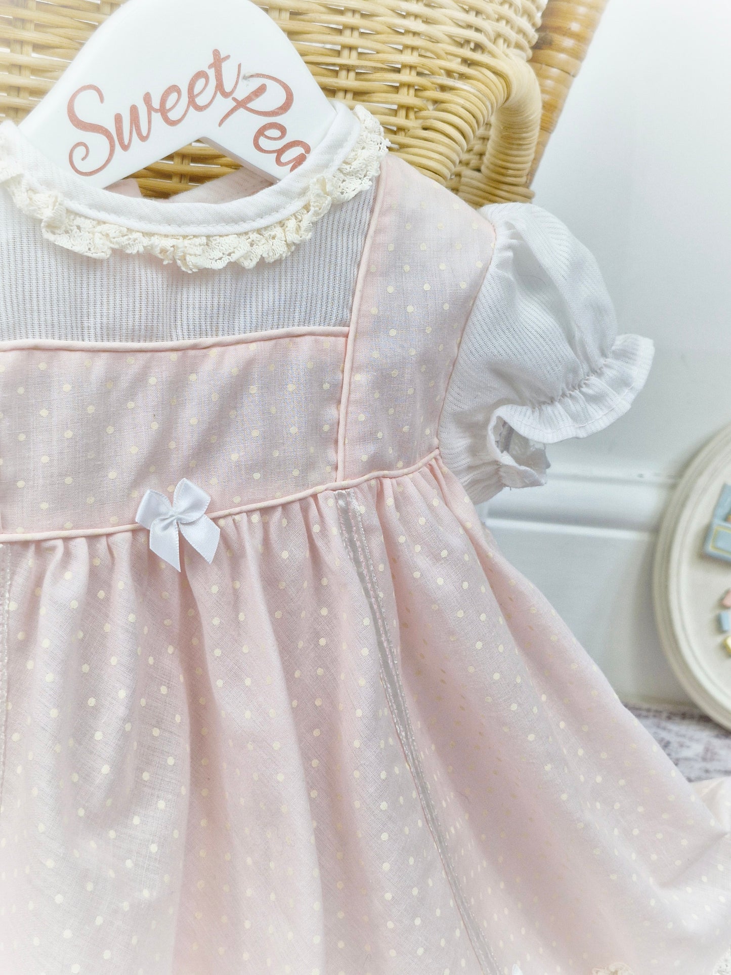 9-12 months. Pink and white polka dot dress with bows, 1960