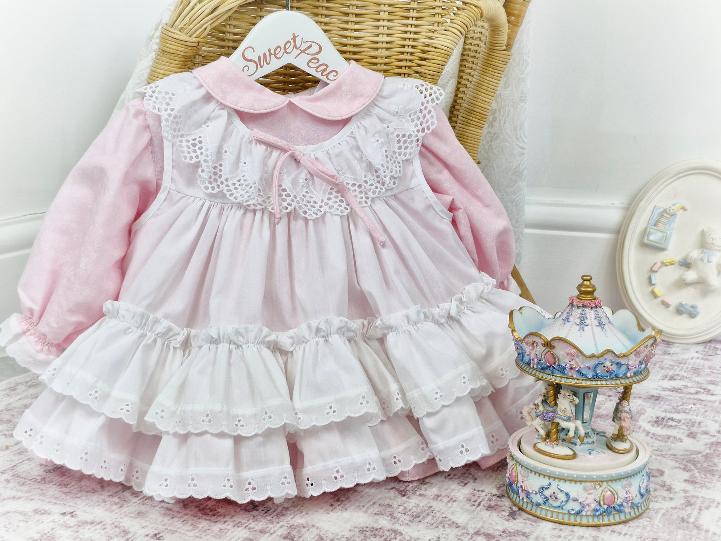 12 months. Pink Bryan dress with white floral print and apron