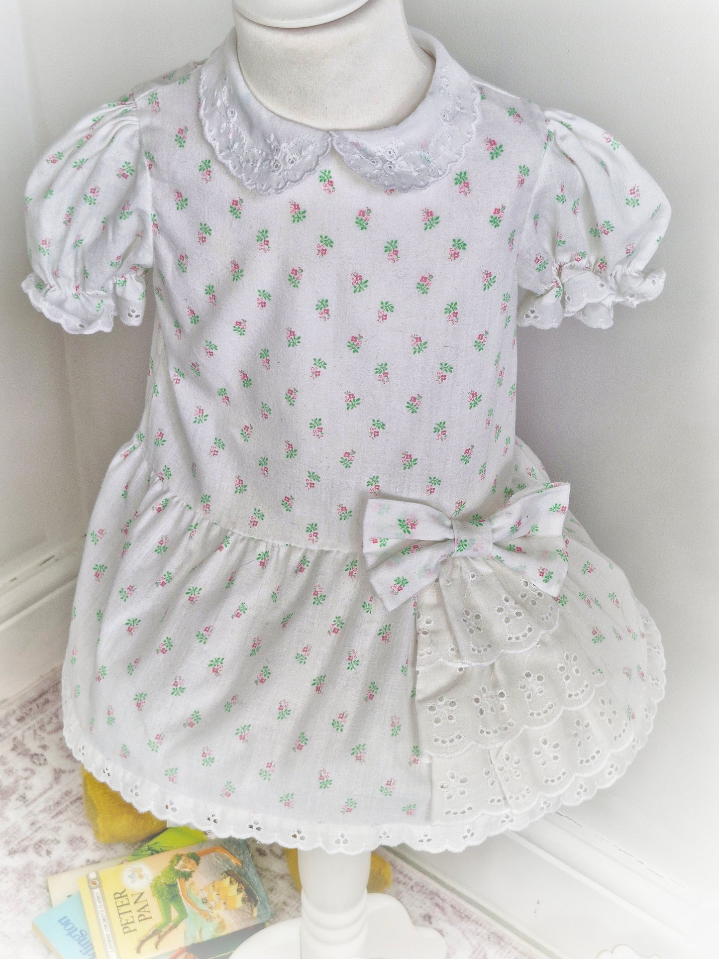 2 years. White dress from Sears with floral print and broderie anglais details