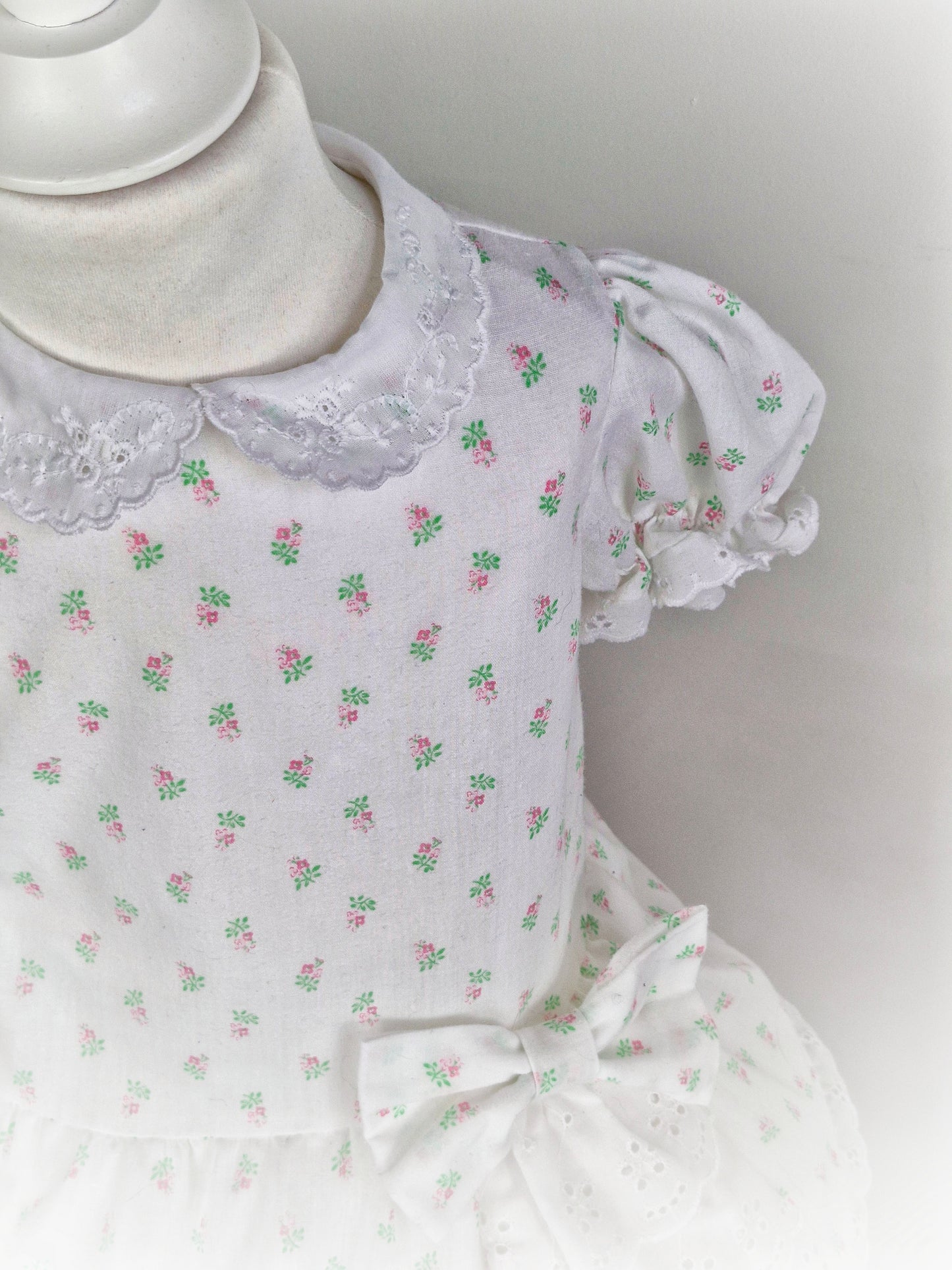 2 years. White dress from Sears with floral print and broderie anglais details