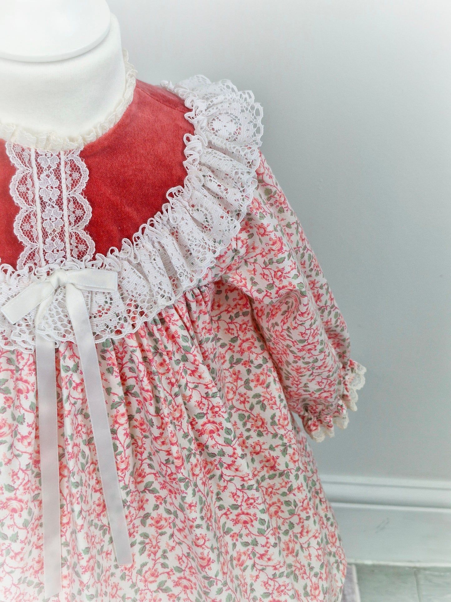 2 years. Red and white floral Bryan with velour top, lace trim and ribbon