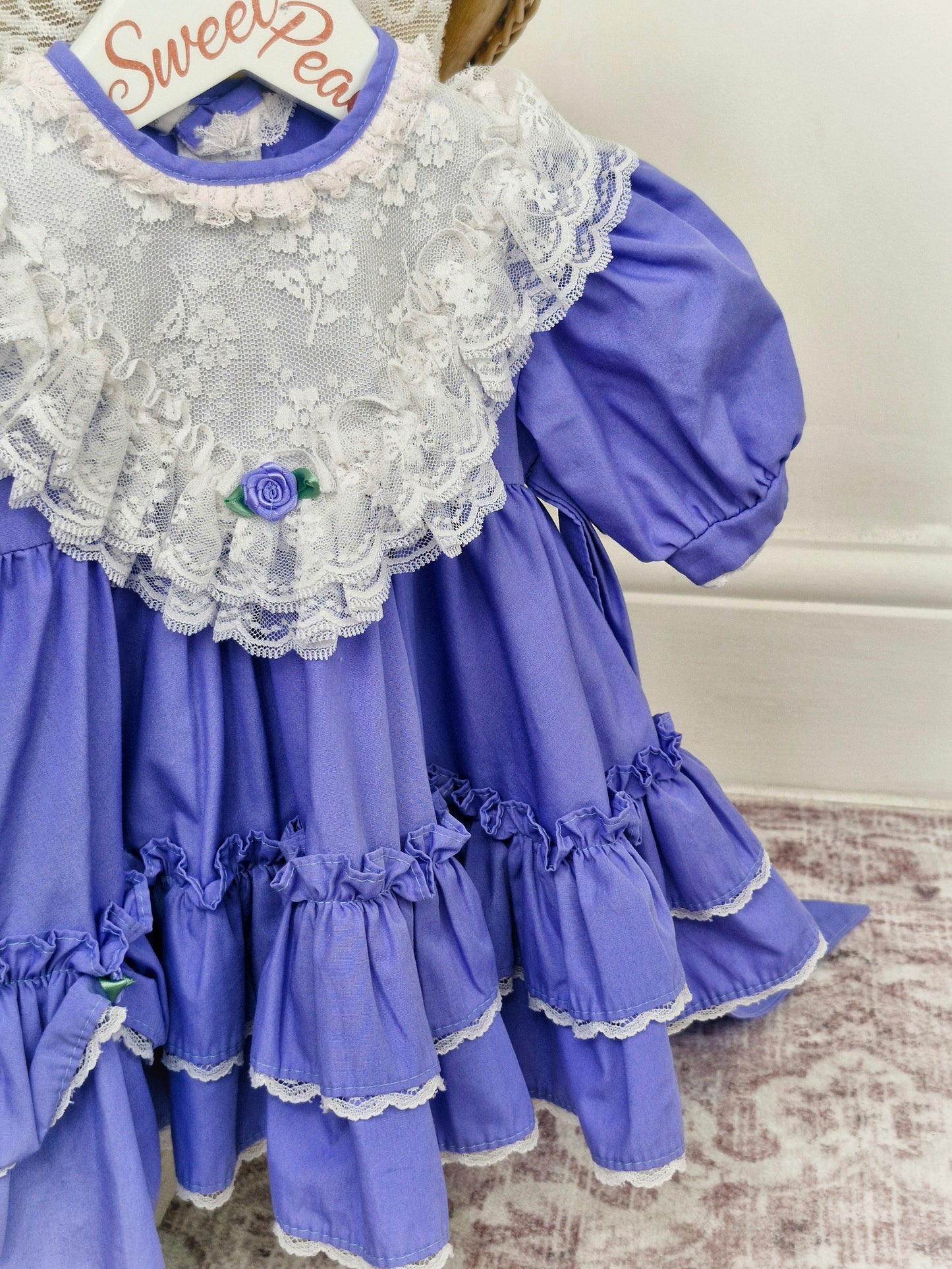 9-12 months. Miniworld dress, white lace bib and rosette