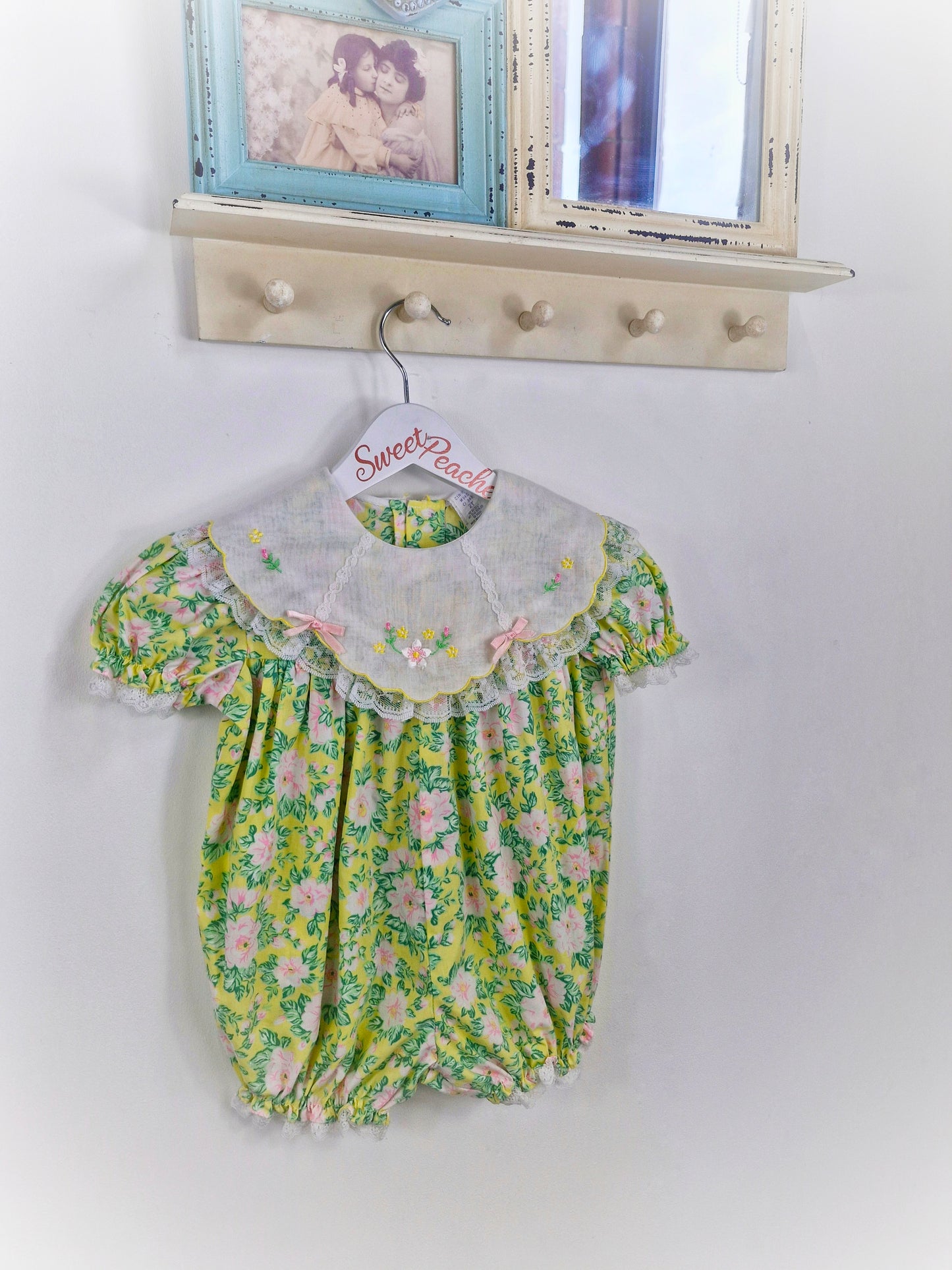 12-24 months. Floral romper with embroidered bib
