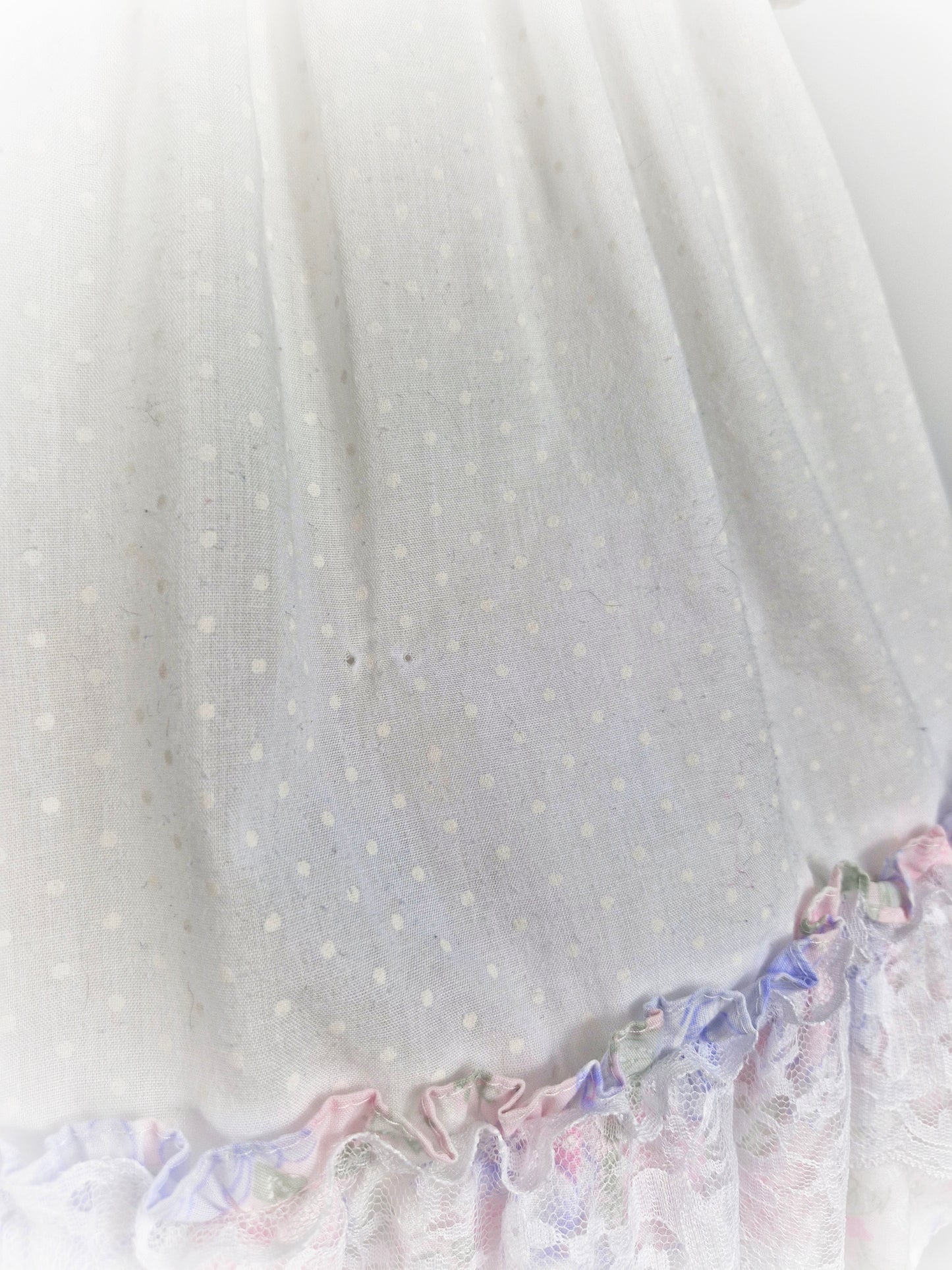 3 years. White dress with pastel flutter sleeves and hem. Cherry applique and lace details