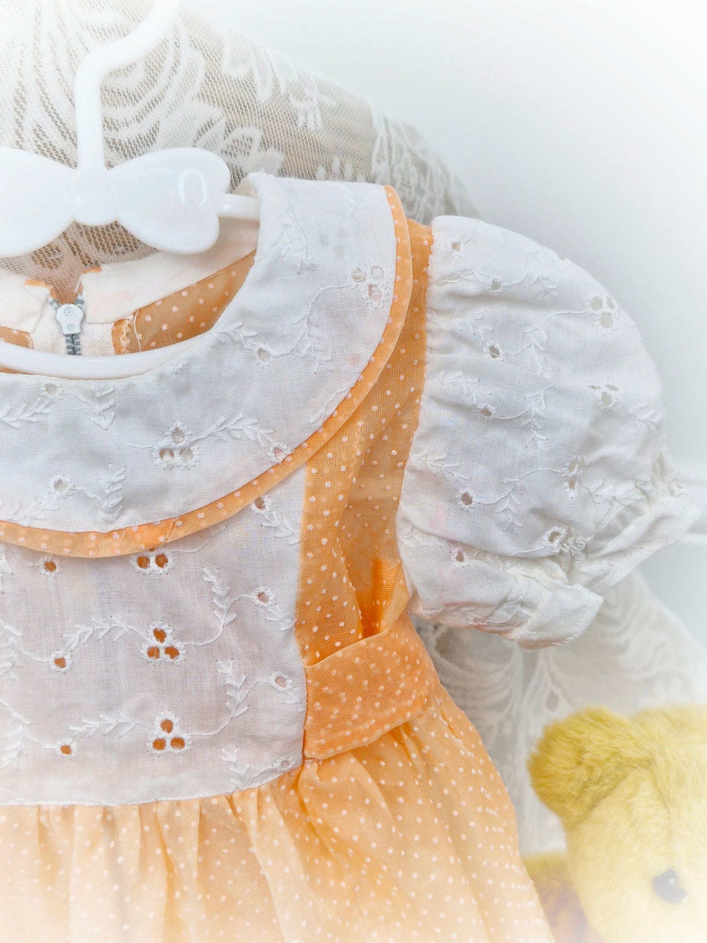 12-18 months. Handmade peach polka dot sheer dress with broderie anglais sleeves, bib and collar