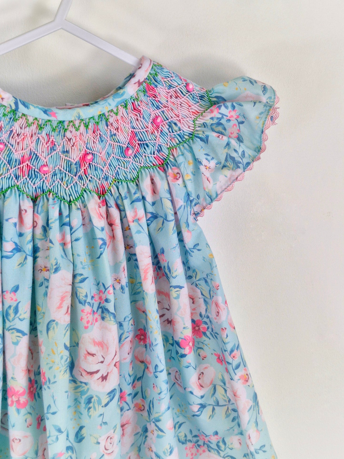 3 years. Vintage inspired Nola Smock. Blue and pinn floral dress with flutter sleeves