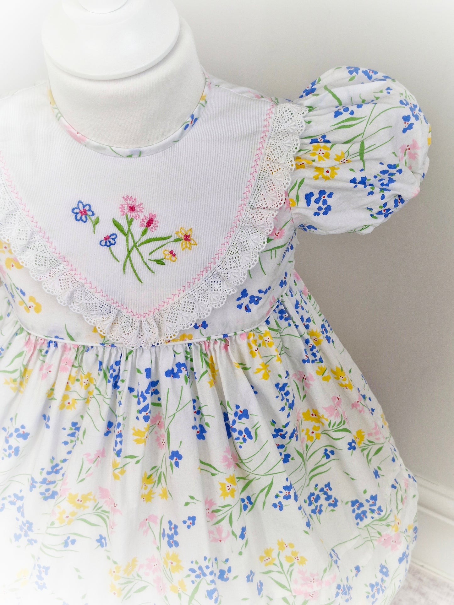 2 years. White floral vintage dress with embroidered bib