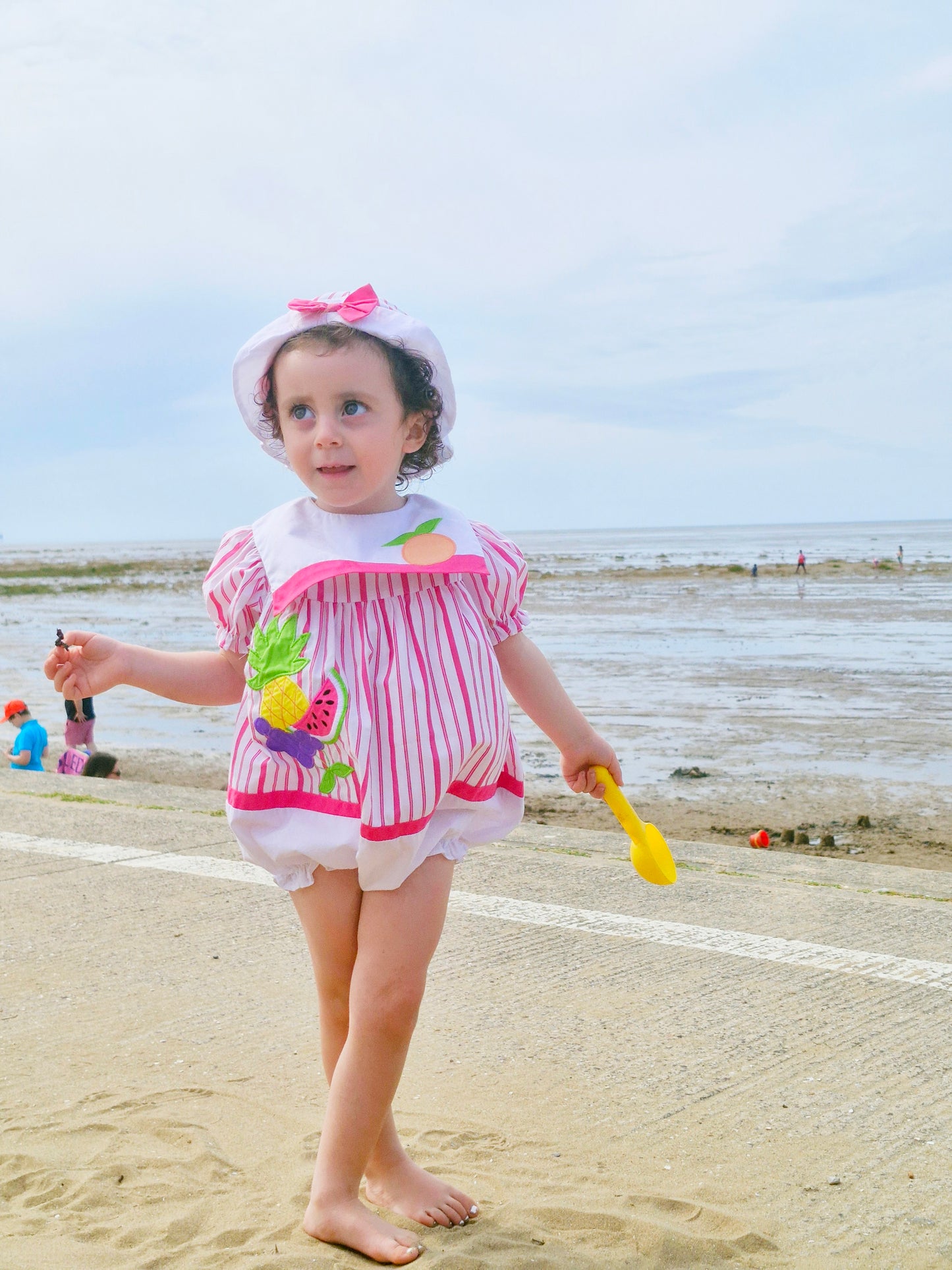 2 years. Vintage romper and matching hat from Nannette, white and hot pink stripes with fruit appliques