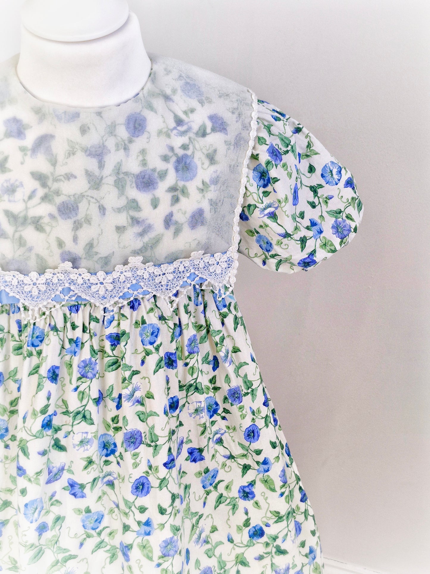 6 years. Allison Ann vintage dress, cream with blue flower print and sheer white bib