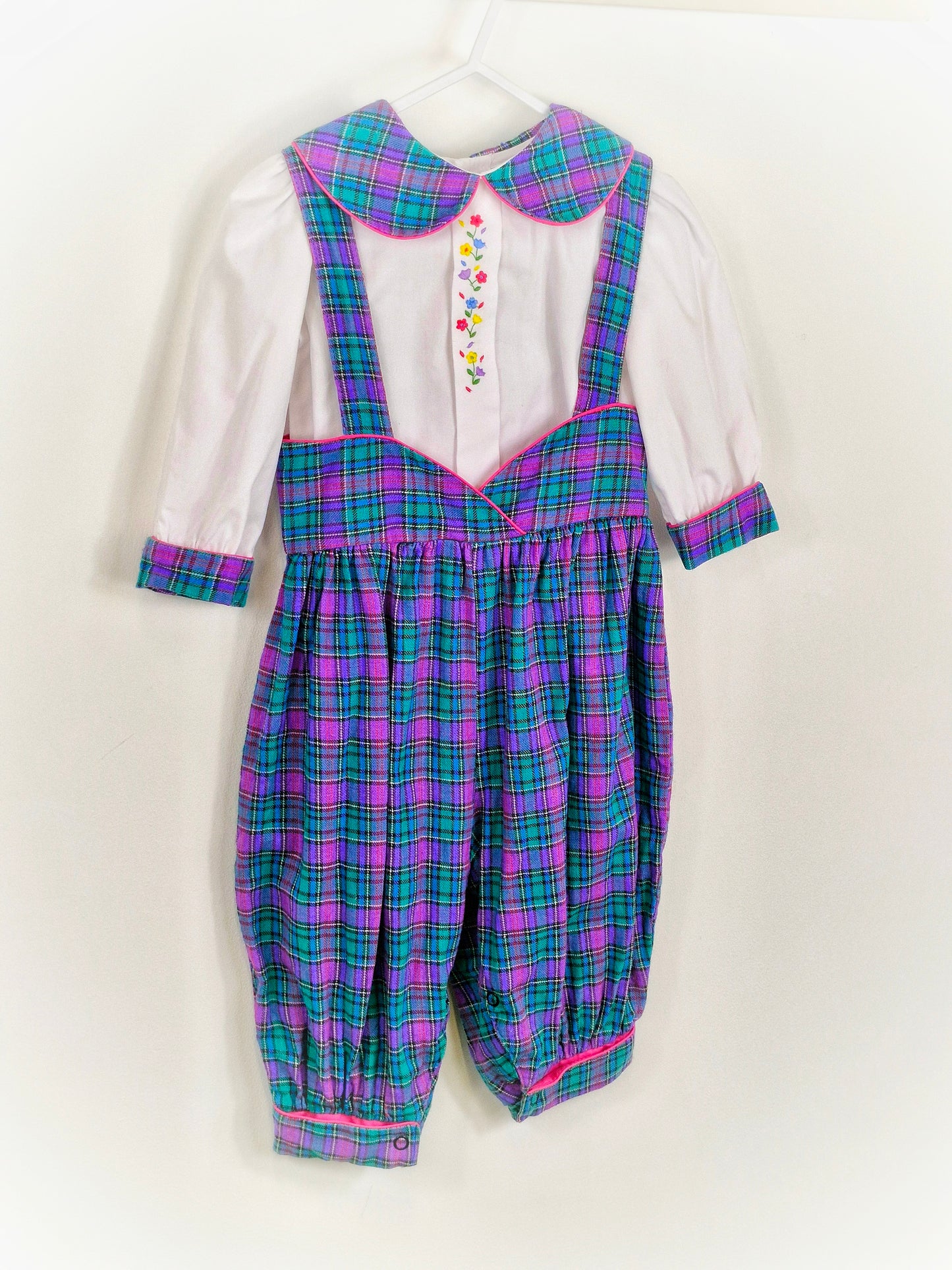 18 months. Two piece set, white blouse with embroidered flowers and checked collar and cuffs. Matching suspenders/pants.
