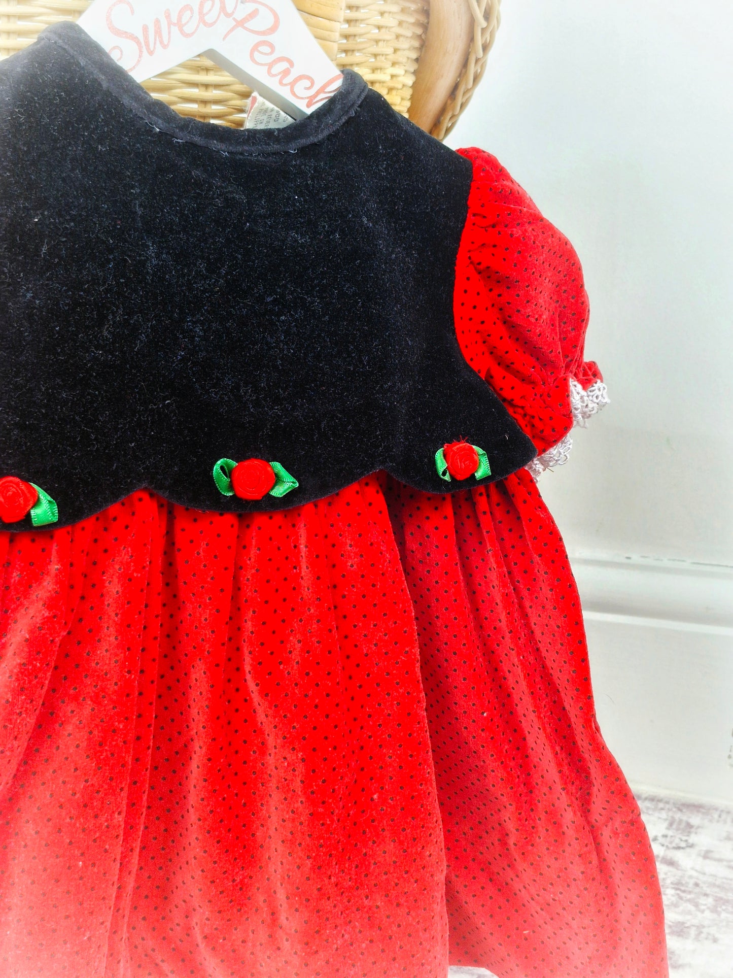 12 months. Red and black velvet dress with polka dots and rosettes