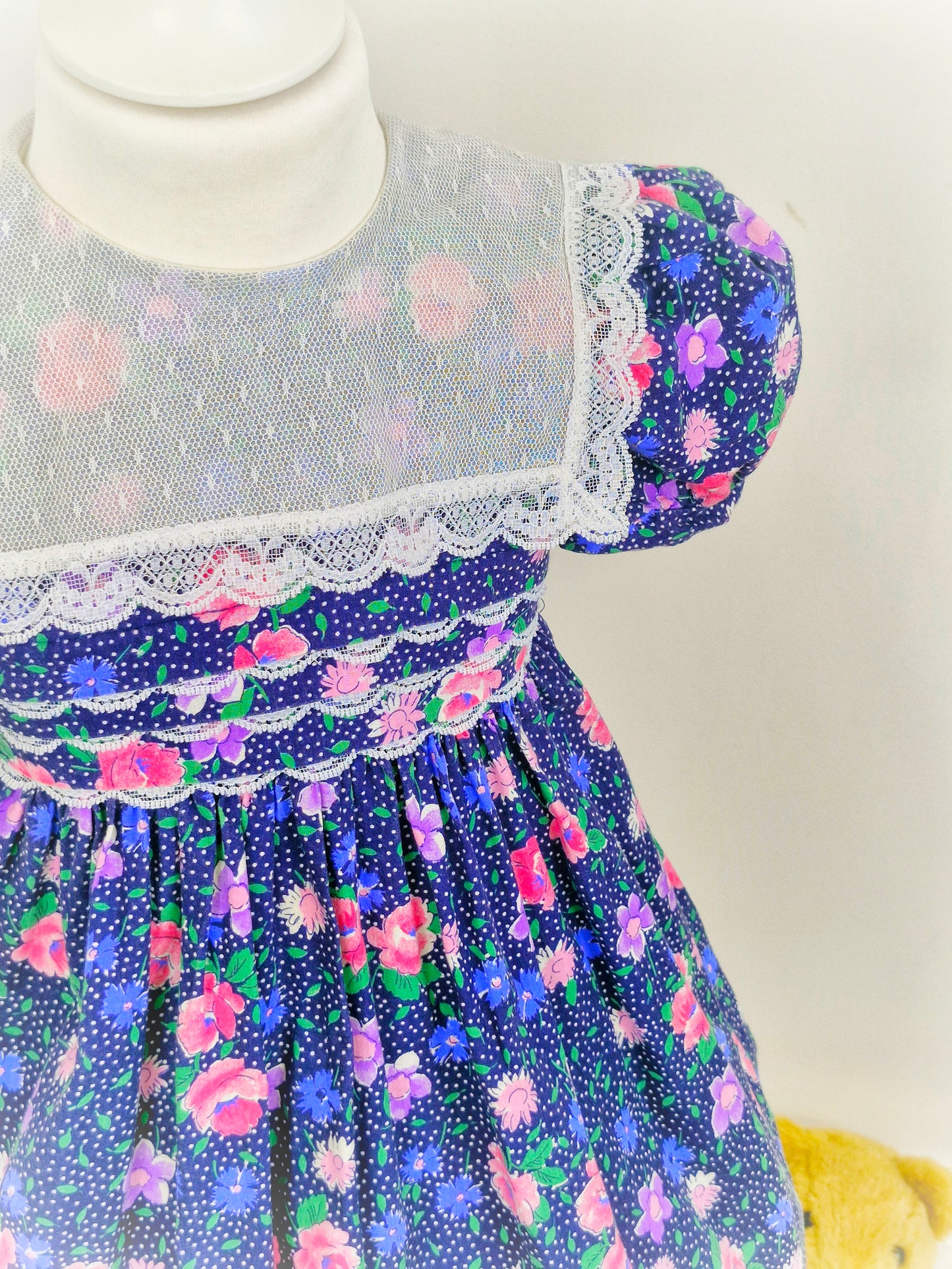 3-4 years. Navy Polly Flinders with flowers, lace and polka dots