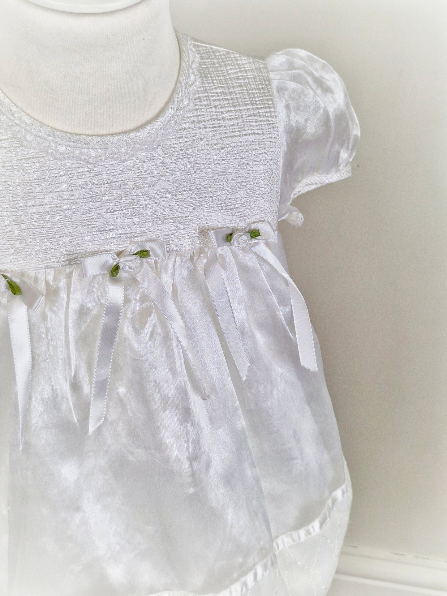 2 years. White satin and taffeta vintage dress from Rose Cottage with white bows and rosettes
