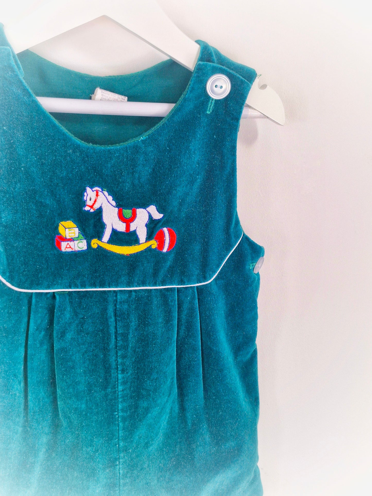 18-24 months. Forest green velvet romper with embroidered rocking horse
