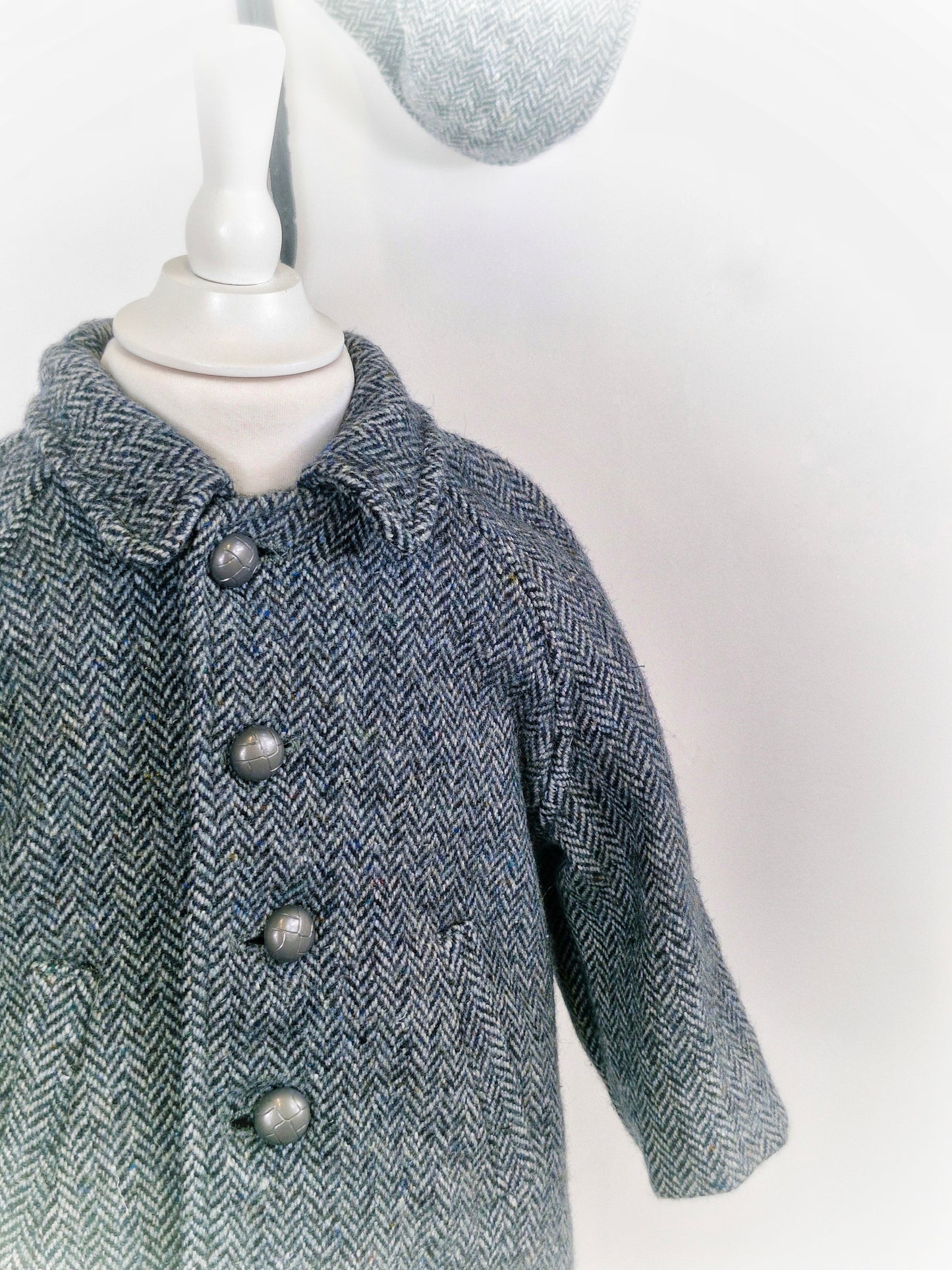 18-24 months. Grey vintage herringbone wool coat with collar and silver buttons and matching hat.
