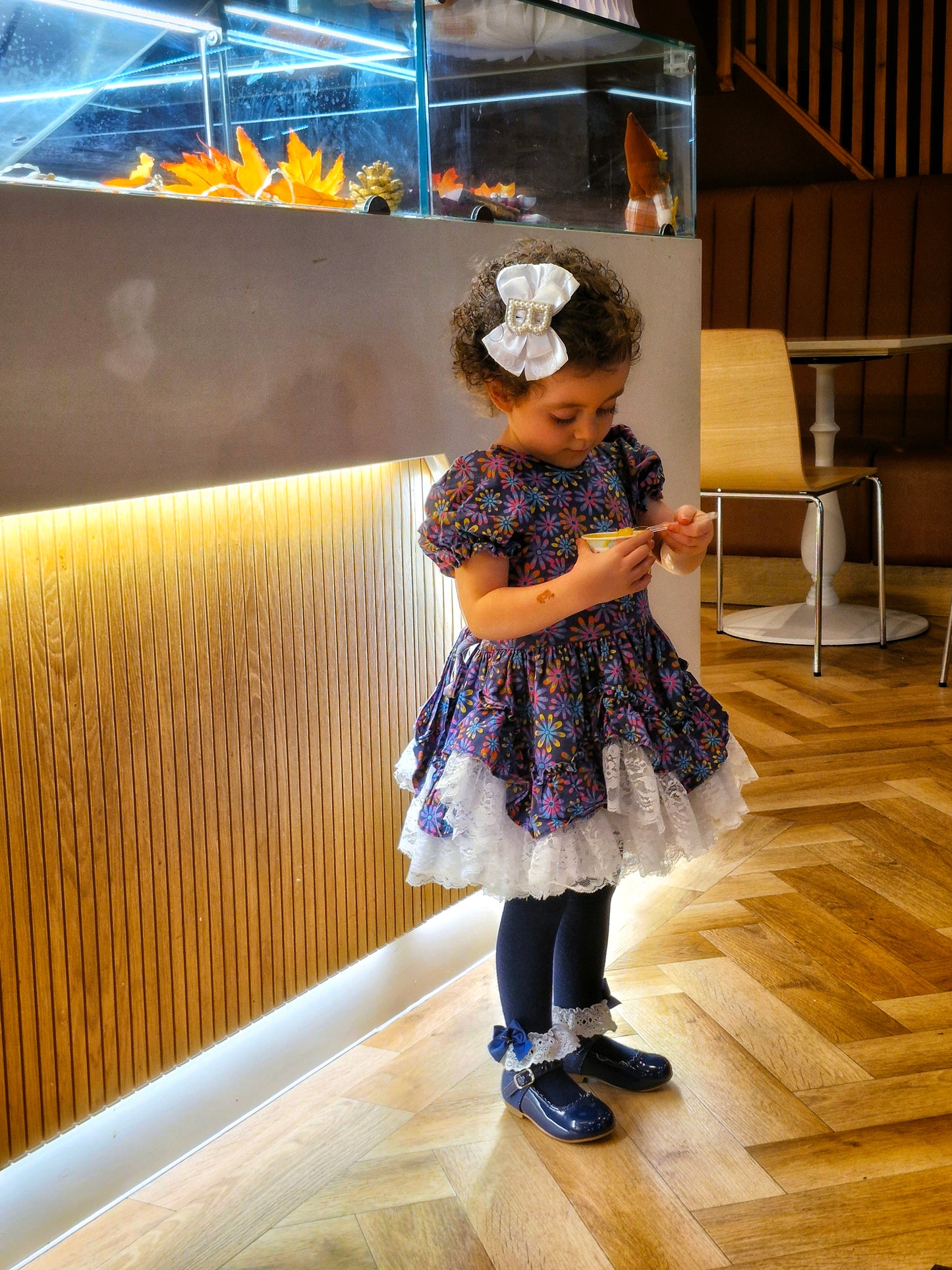 3 years. Navy blue floral Lid'l Dolly with white lace ruffles and puff sleeves