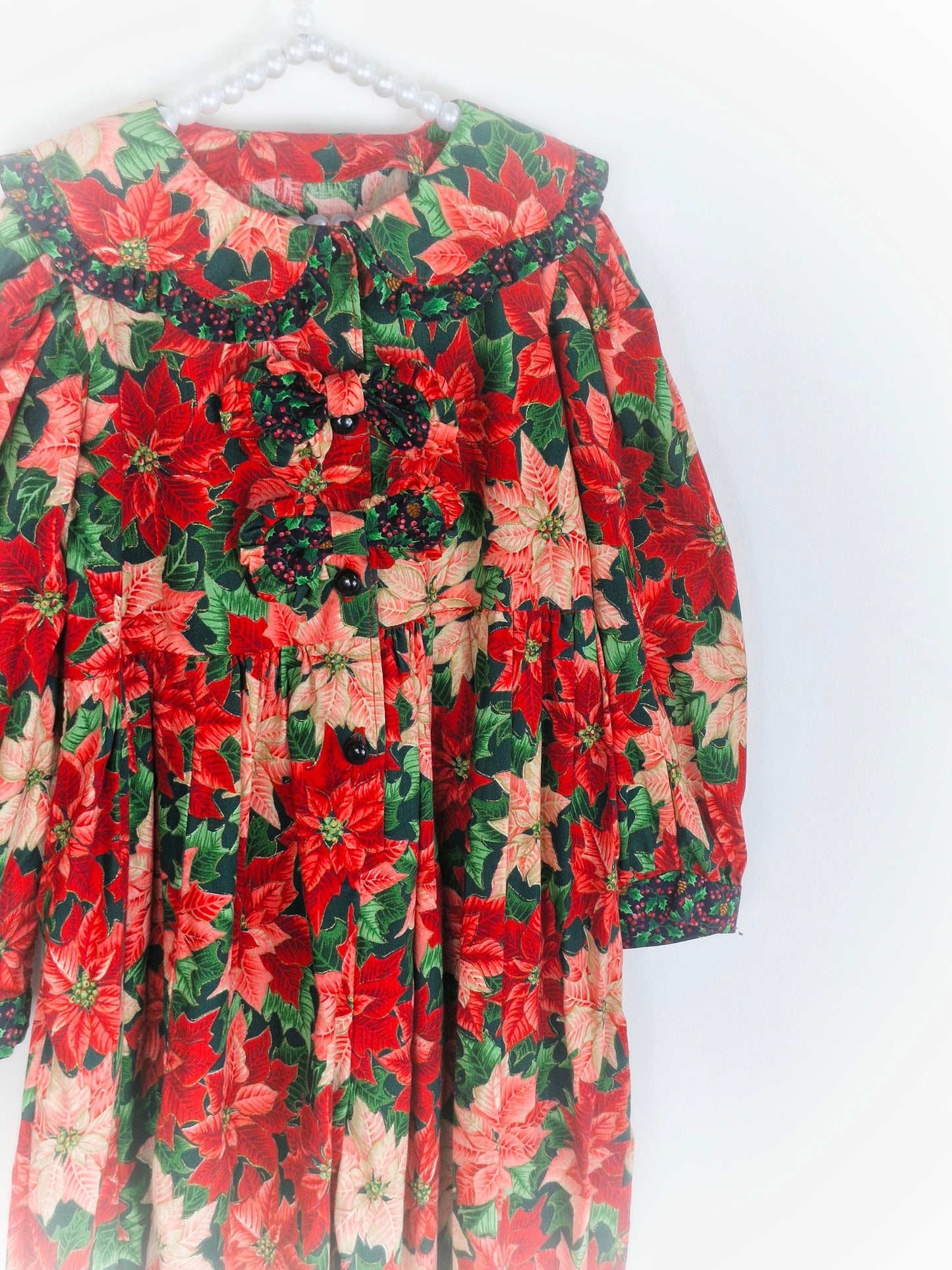 3 years. Vintage romper with poinsettia print, long sleeved with large collar and ruffle trim