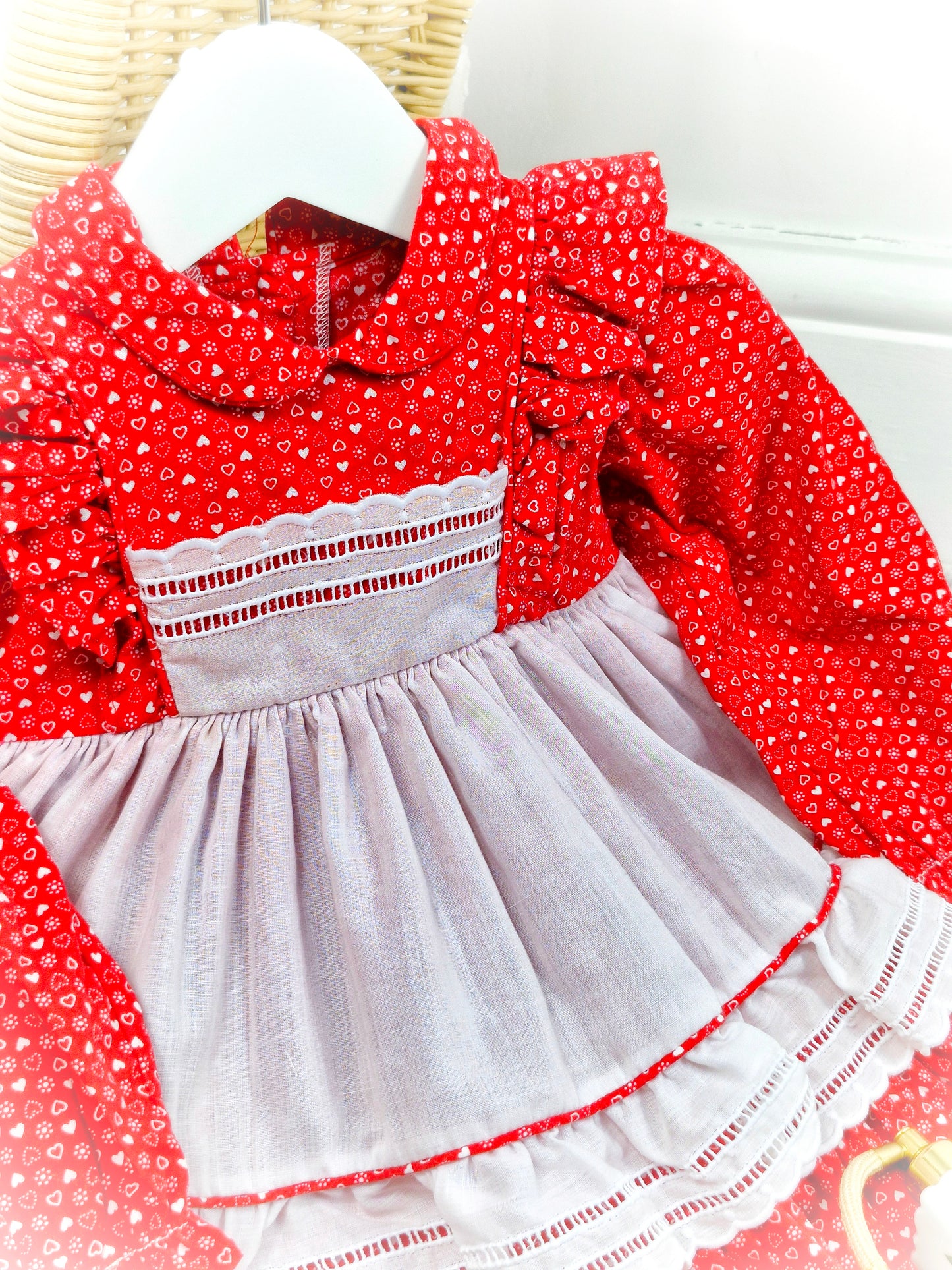 12-18 months. Red vintage dress with white heart print and faux pinny. Flutter shoulders and Peter Pan collar