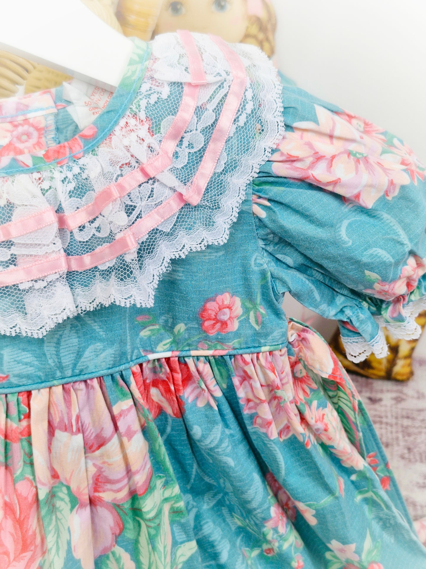 18-24 months. Teal vintage dress by Petit Amour, pink ribbon and flowers with white lace and puff sleeves