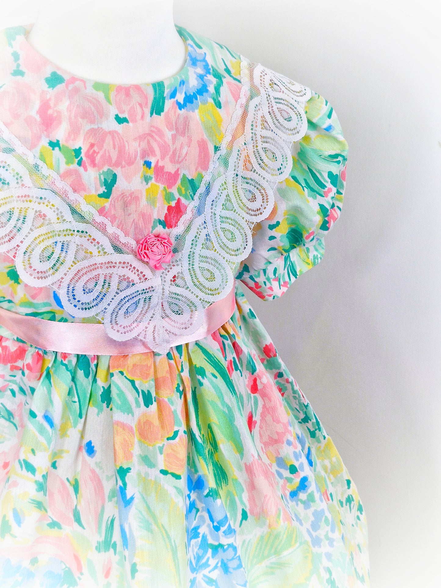 3-4 years. Watercolour printed vintage dress from Cuddle Teen with pink ribbon and large bib