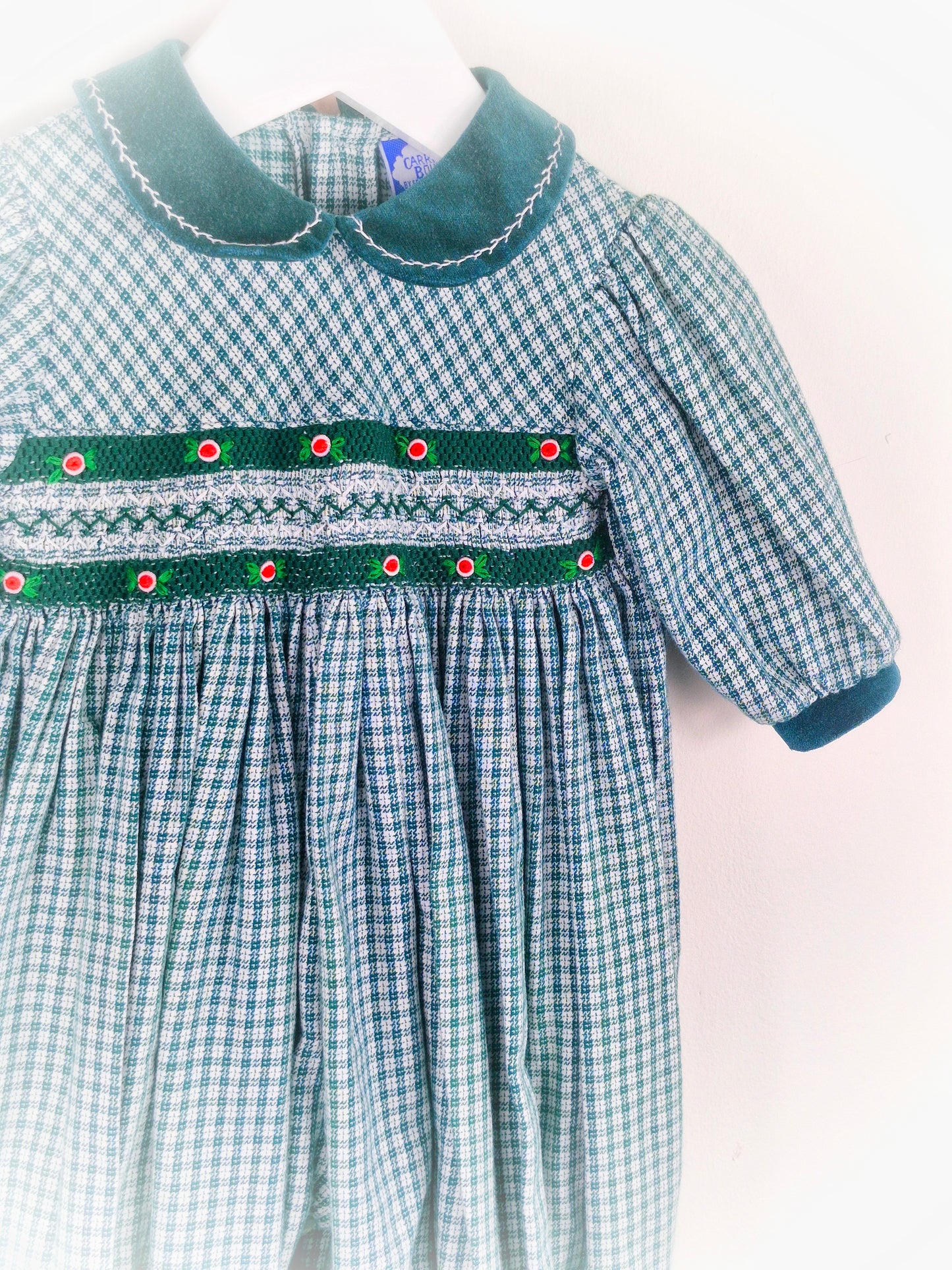 6-9 months. Green smocked romper by Carriage Boutique
