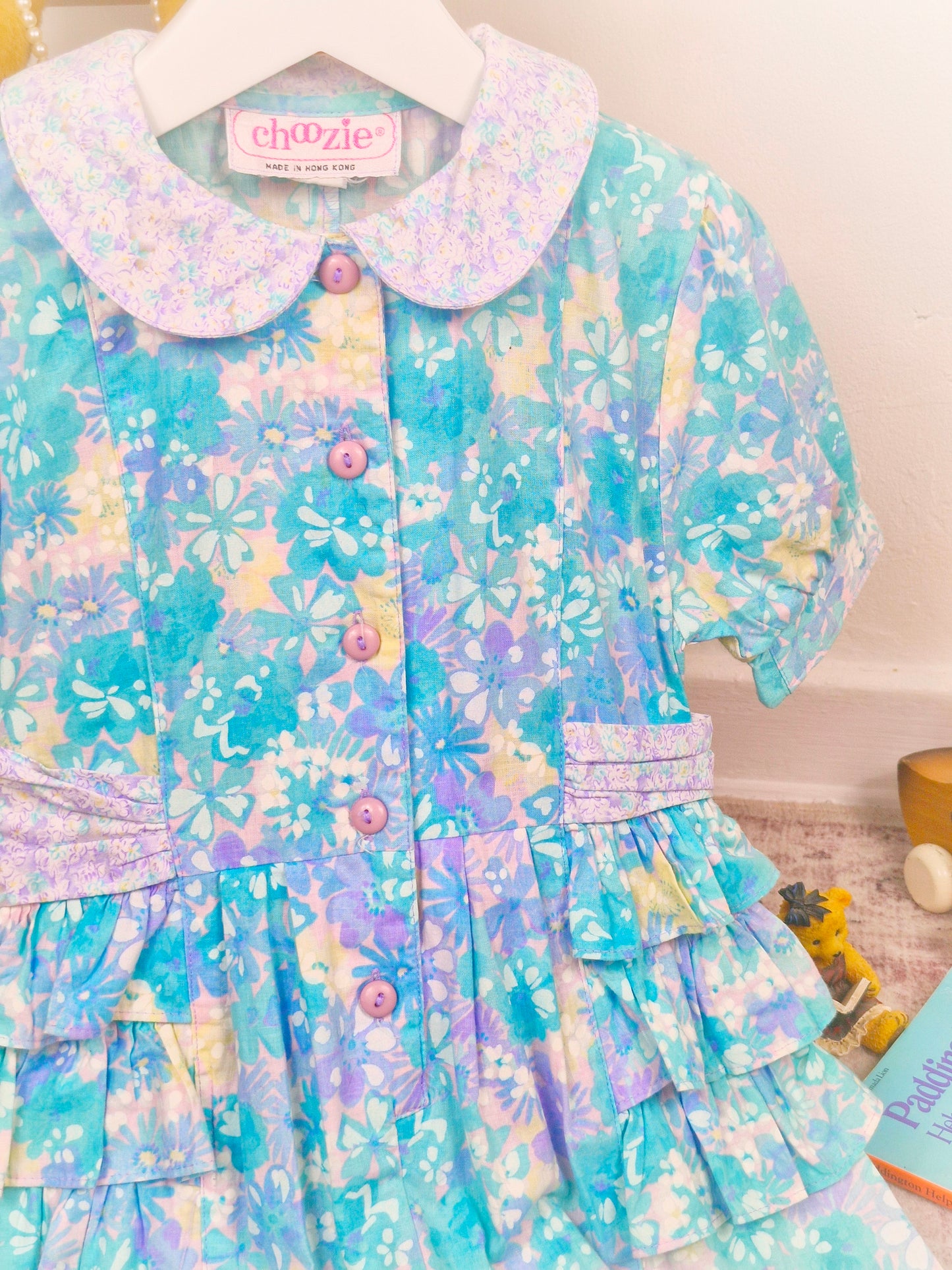 3 years. Floral button down romper with ruffle sides