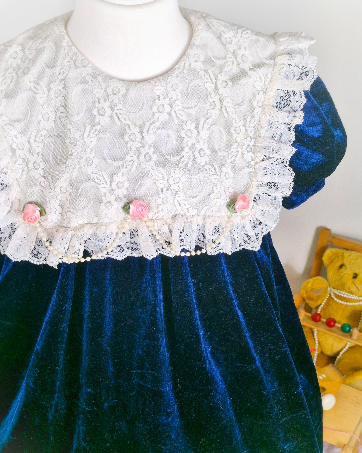 5-6 years. Navy velour vintage dress from Nutcracker with white lace bib, pink rosettes and pearl details