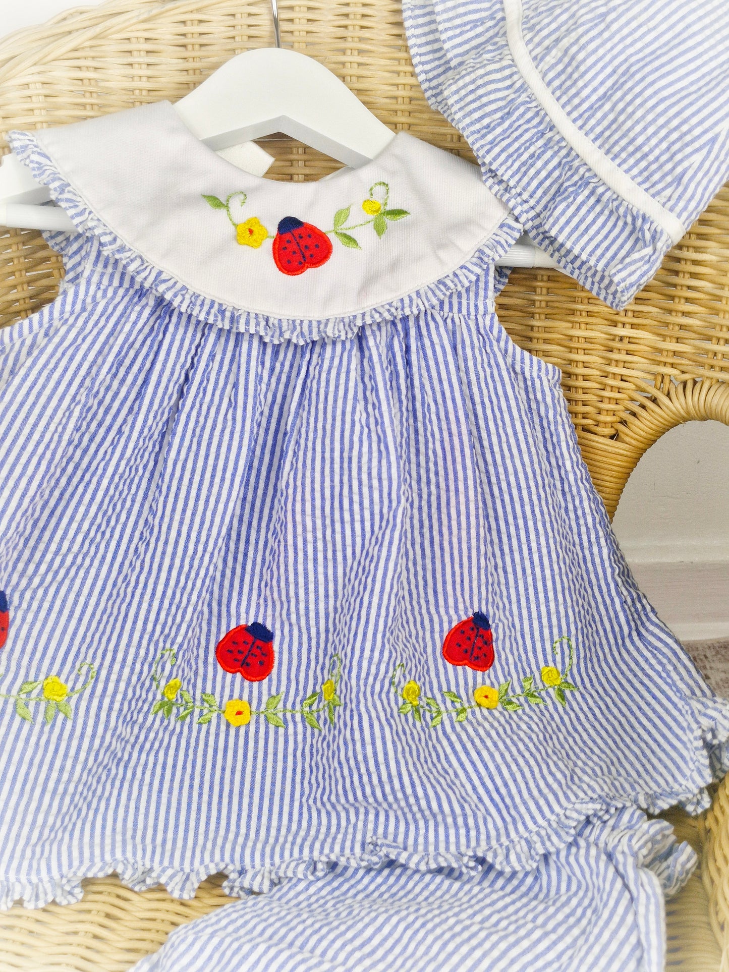 12-18 months. Three piece vintage Itty Bitty set, dress, bloomers and hat with embroidered flowers and ladybugs.