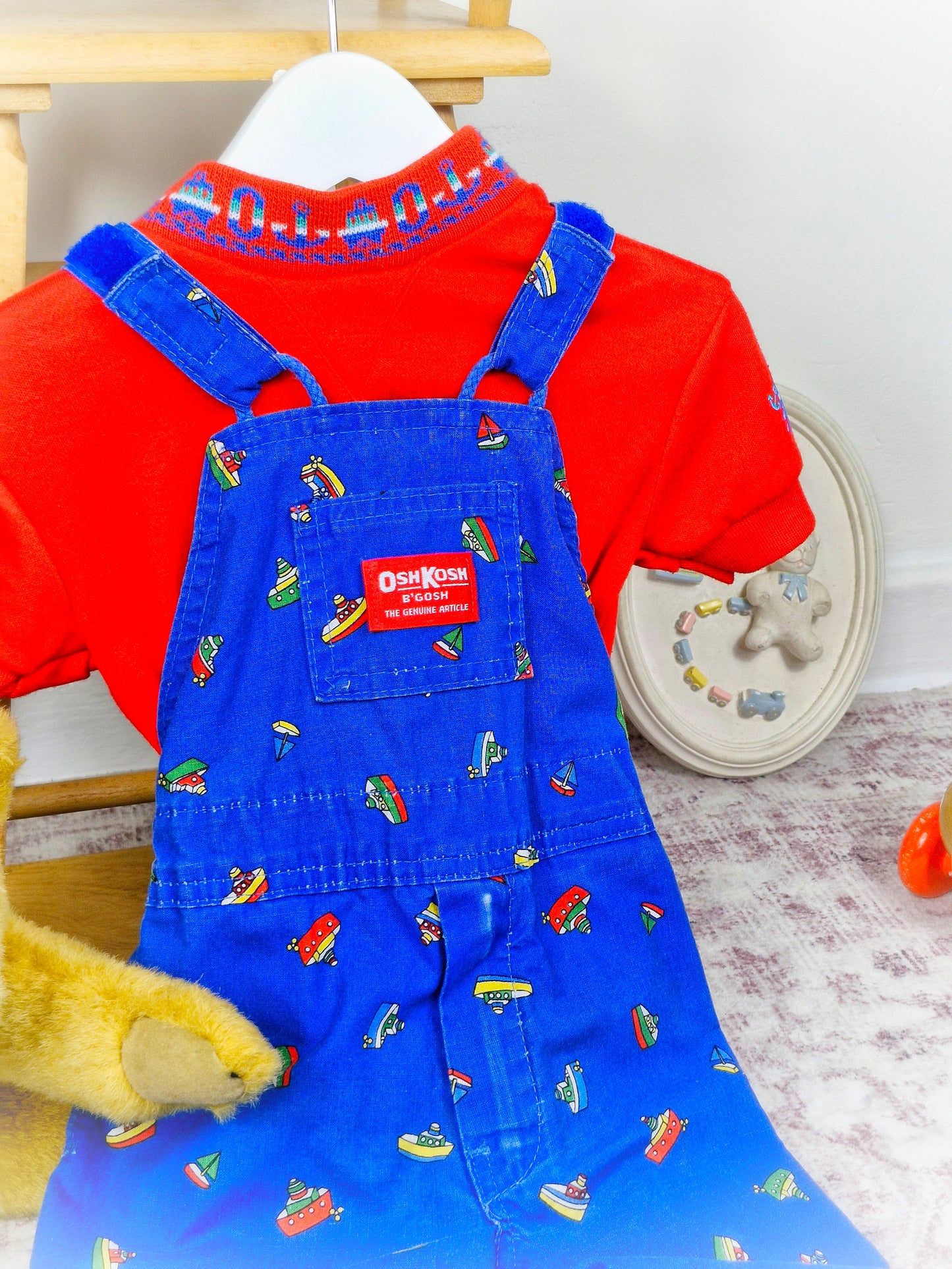 12-18 months. Two piece OshKosh set, tshirt and dungarees with boat print