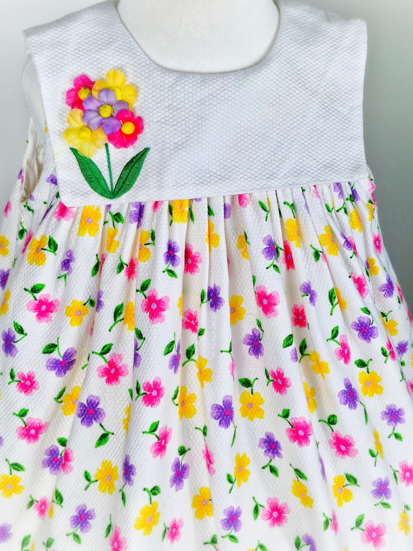 3-4 years. White sleeveless vintage Good Lad of Philadelphia dress with bright floral design