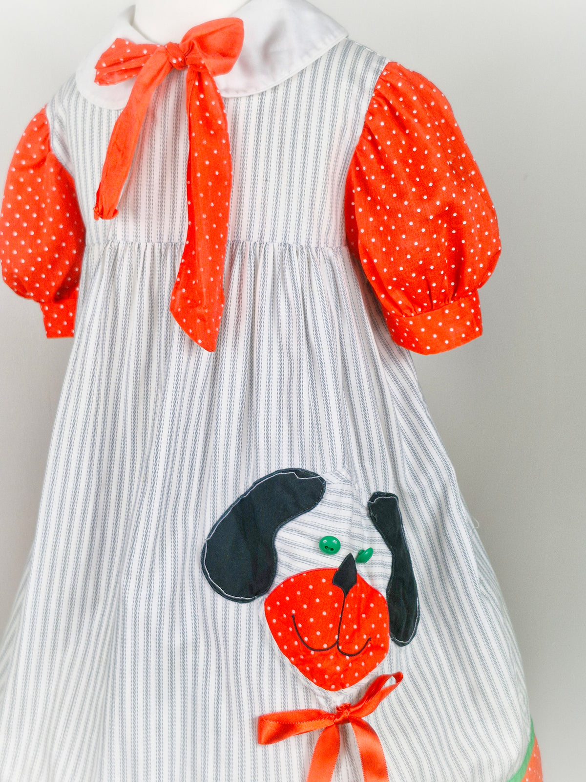 5 years. White vintage Fayette with grey stripes, red polka dot sleeves and details