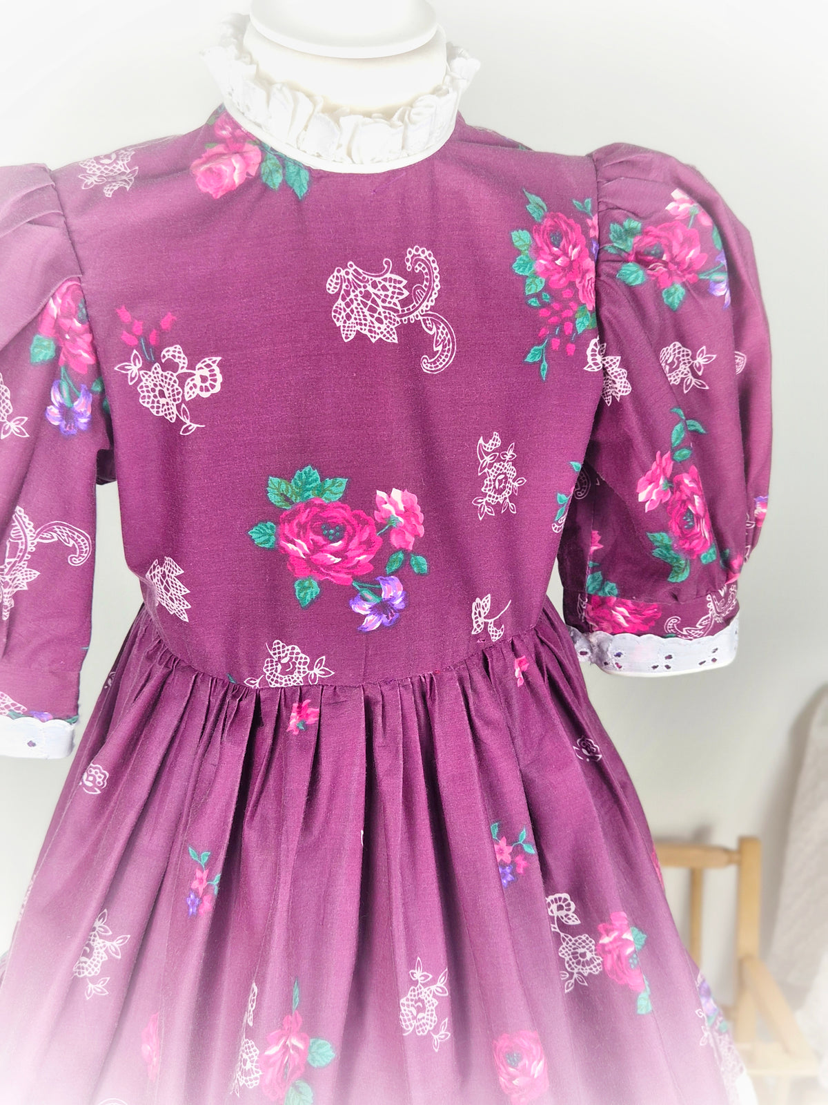 7 years. Handmade Daisy Kingdom dress, burgundy with floral designs