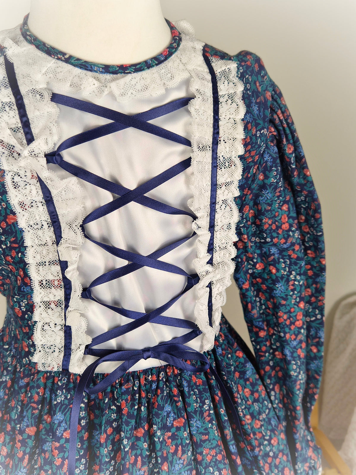 7-8 years. Navy floral vintage dress by Carolyn's Collection with satin ribbon and lace