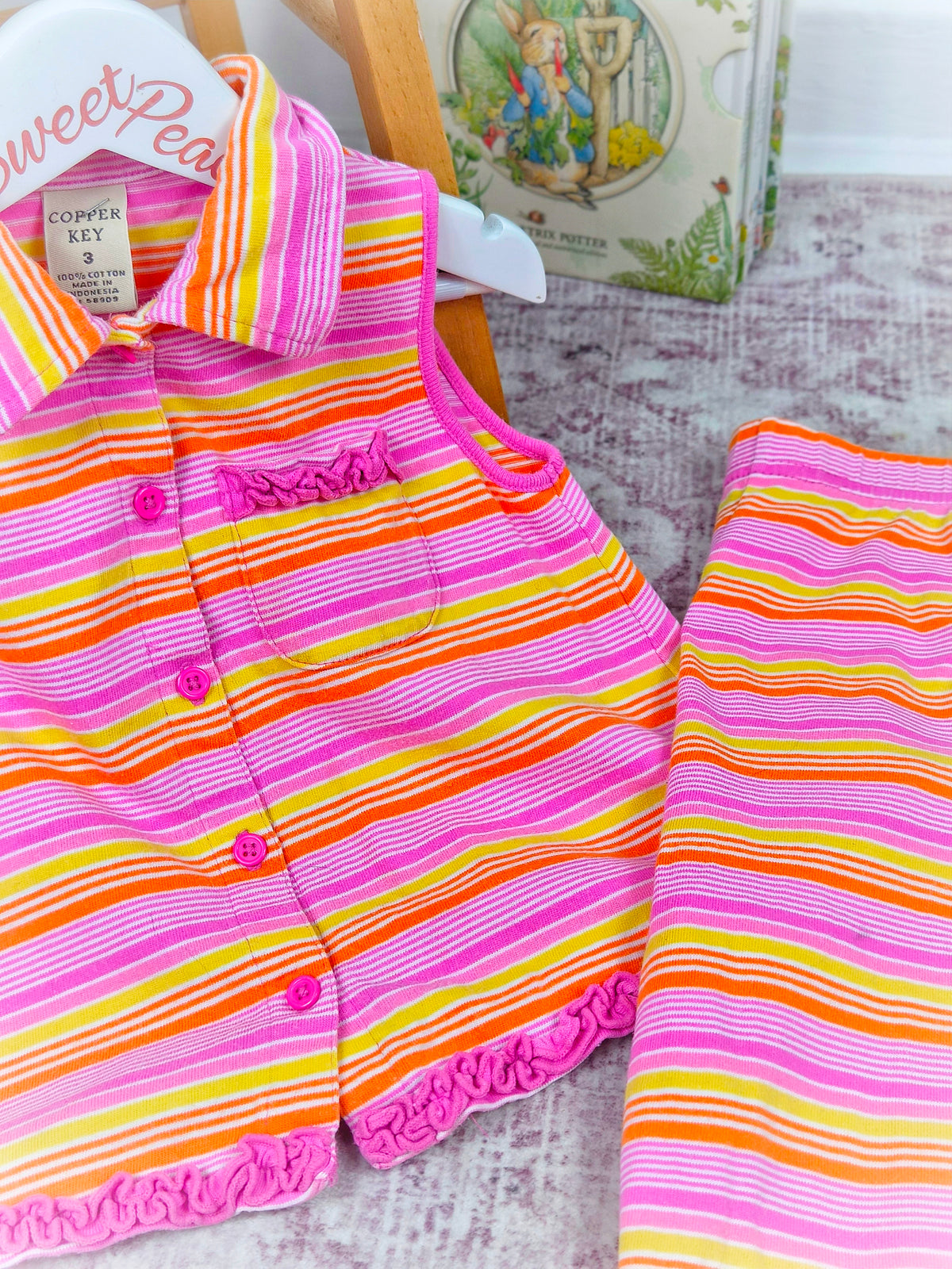 3 years. Pink, yellow and orange striped two piece set