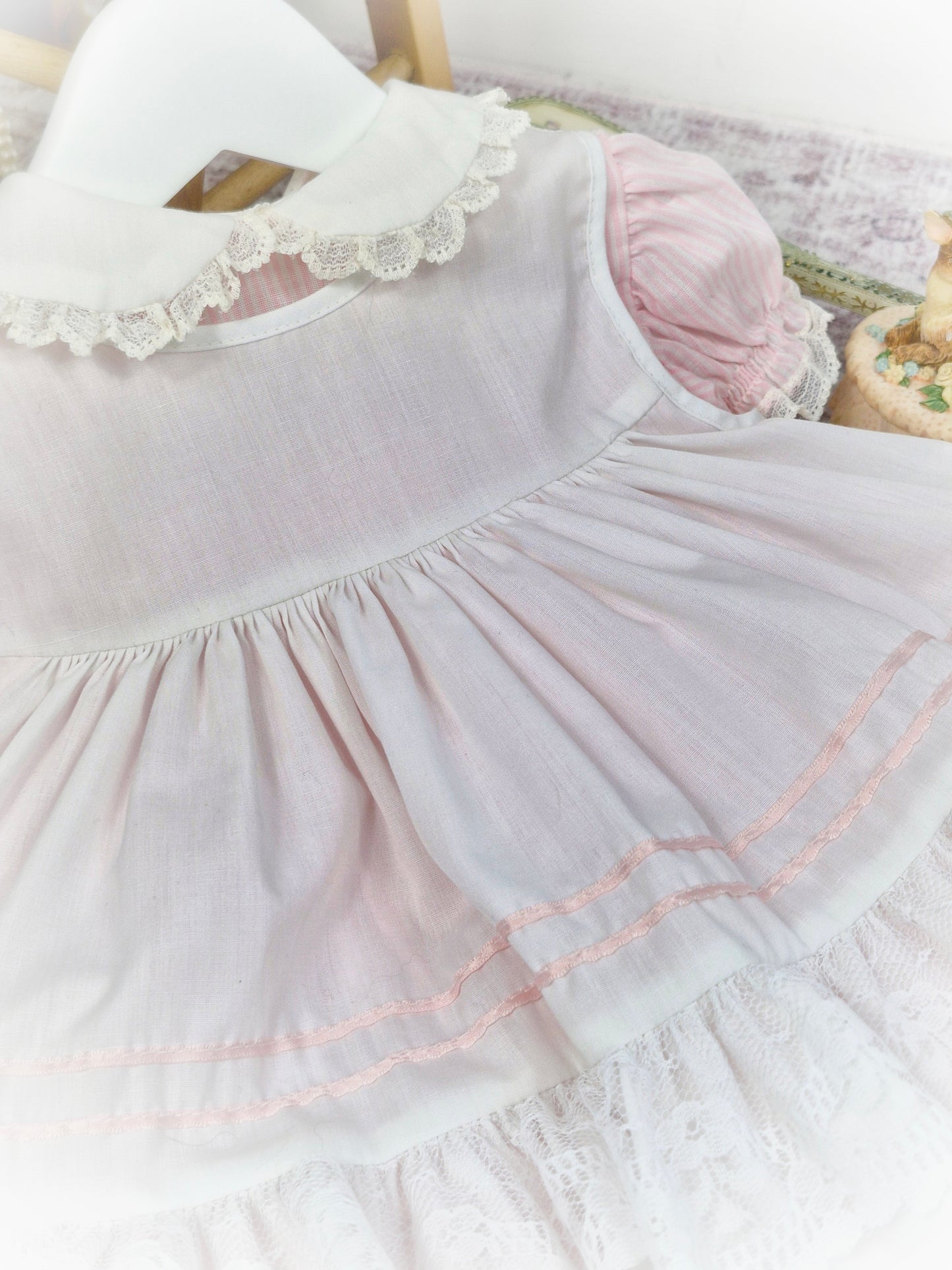 9-12 months. Vintage pink and white candy striped Bryan dress with white apron, pink satin lace, ruffles and lace