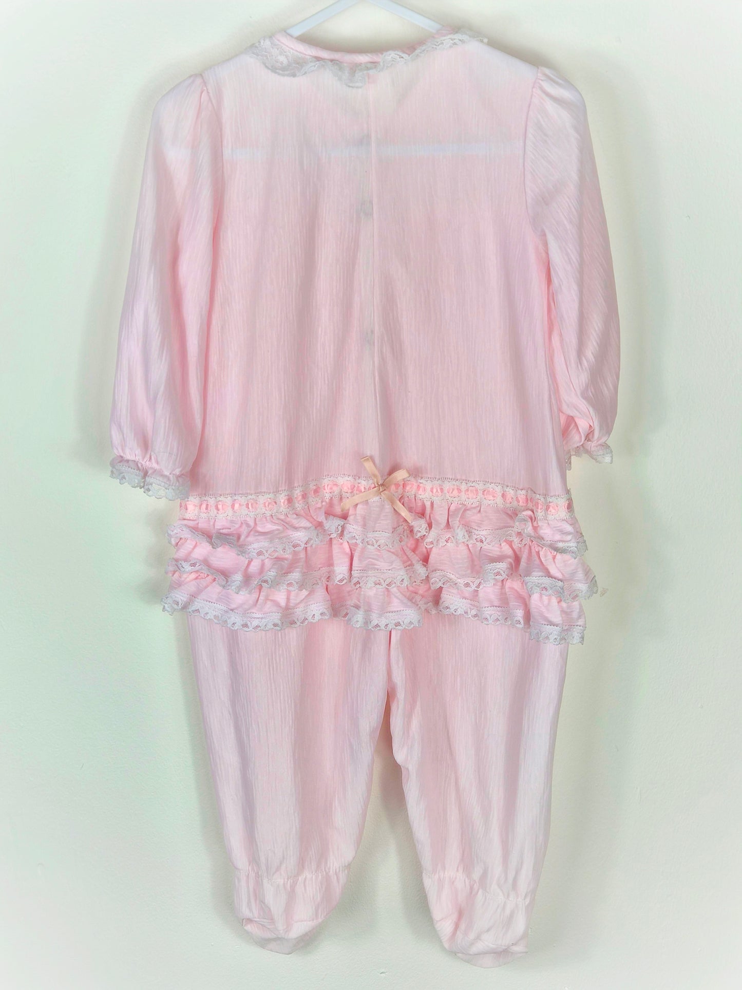 12 months. Pink vintage sleepsuit sith lace, ribbons and frills