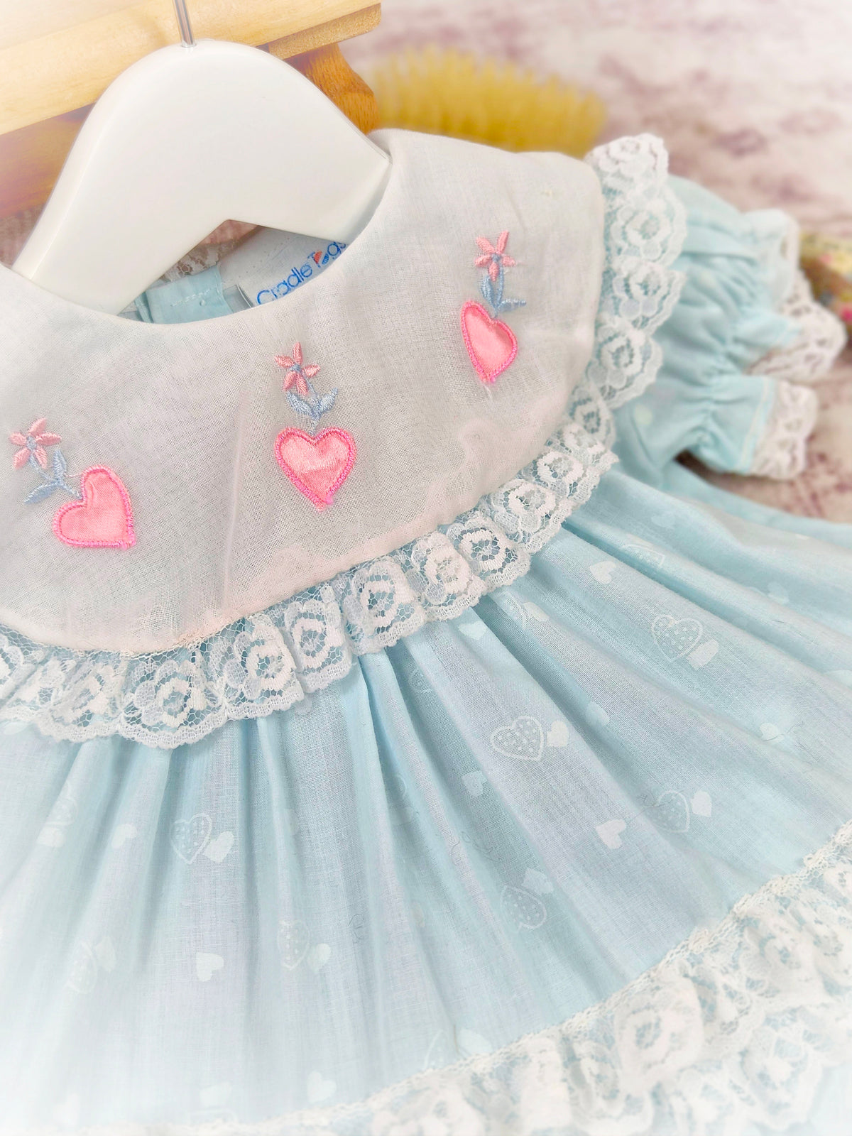 12 months. Mint vintage dress with white bib, pink embroidered hearts and lace trim