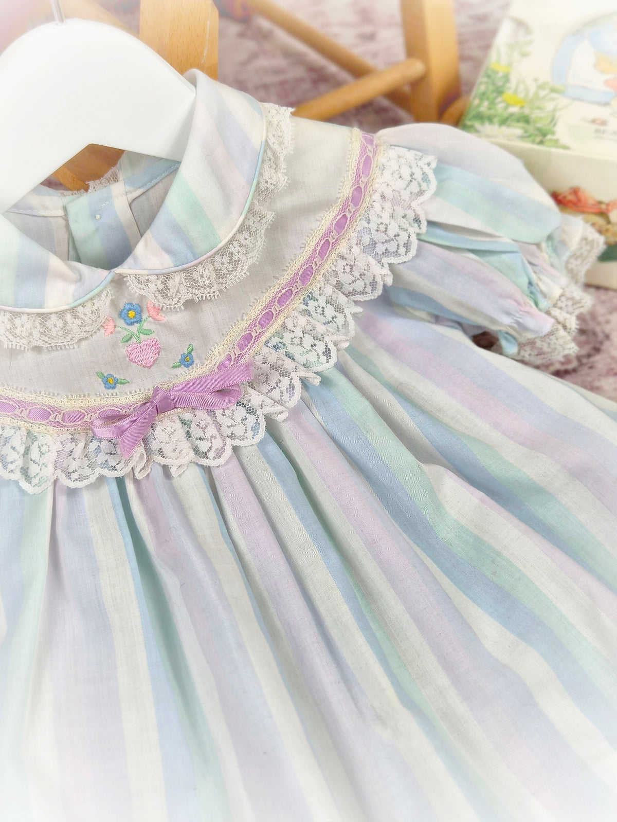 9-12 months. Pastel striped vintage dress with lace details and embroidered design
