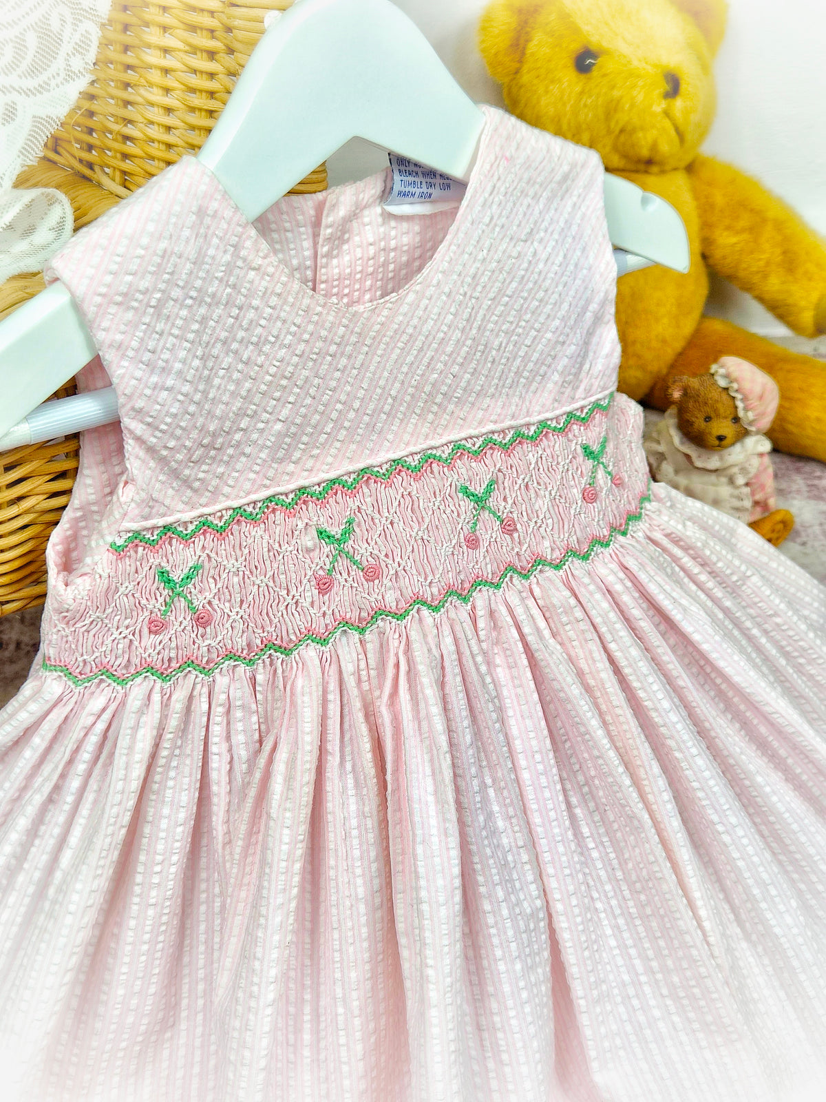 12 months. Pink sleeveless vintage smock dress with embroidered cherries