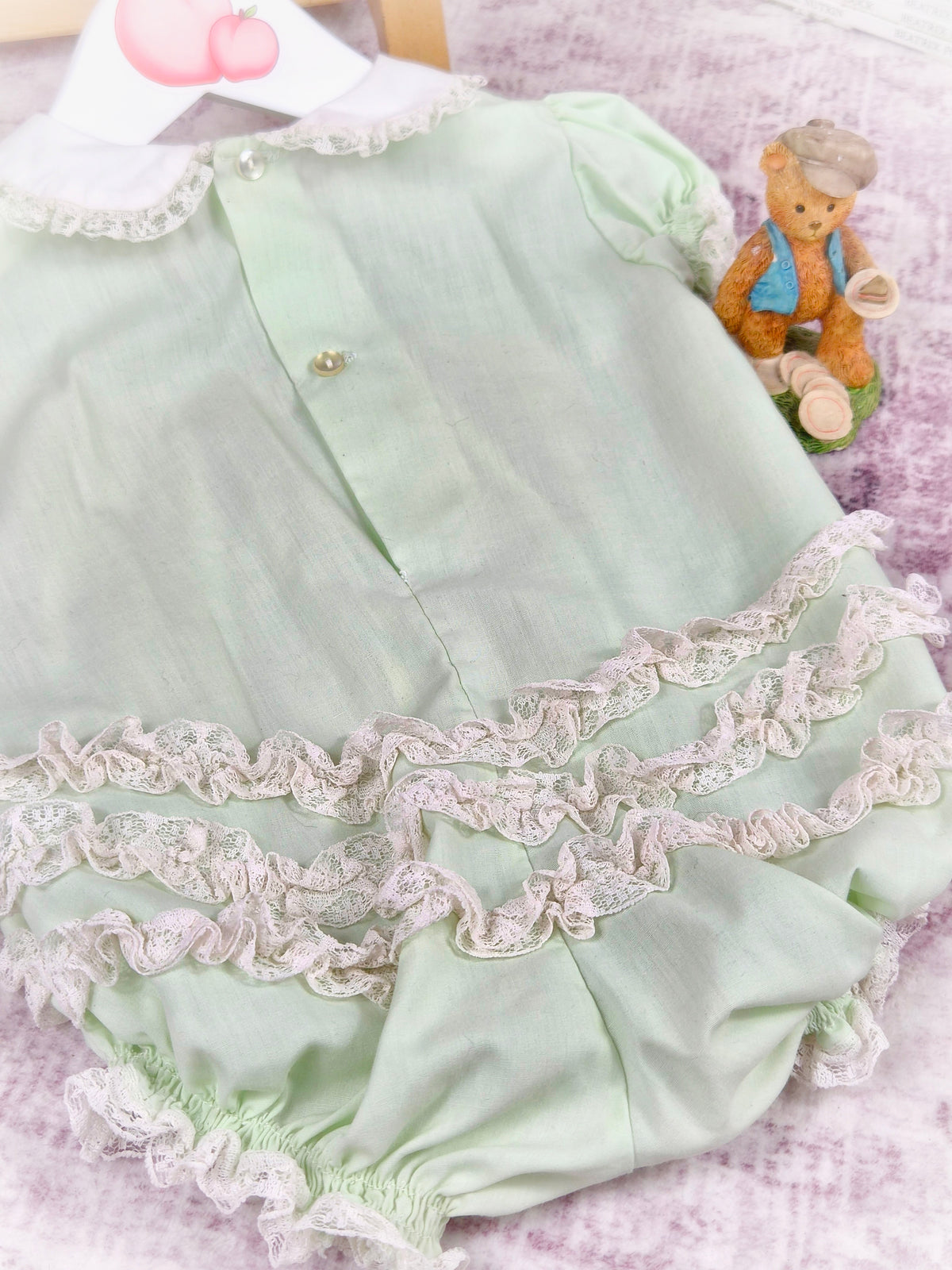 6-12 months. Mint vintage short romper from Bryan with white collar and lace details