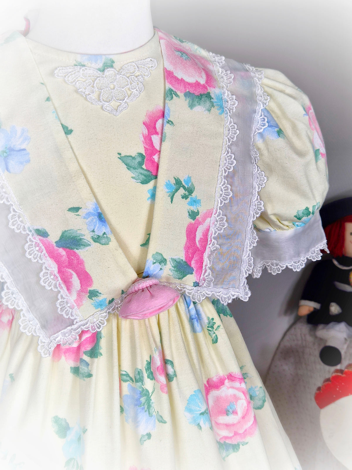 4-5 years. Lemon vintage dress by Atlanta with pink and blue floral print and white lace details
