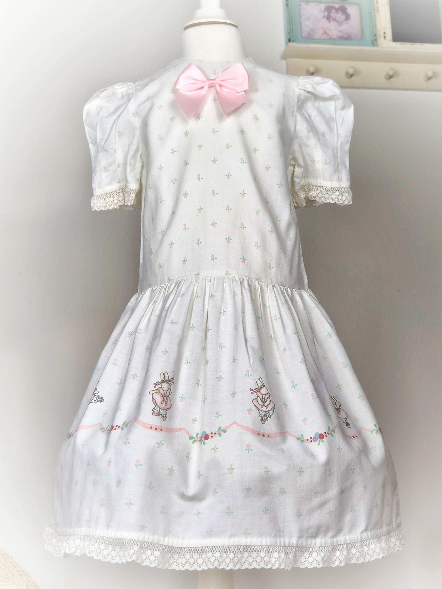6 years. White vintage Daisy Kingdon dress with pink satin bow and bunnies